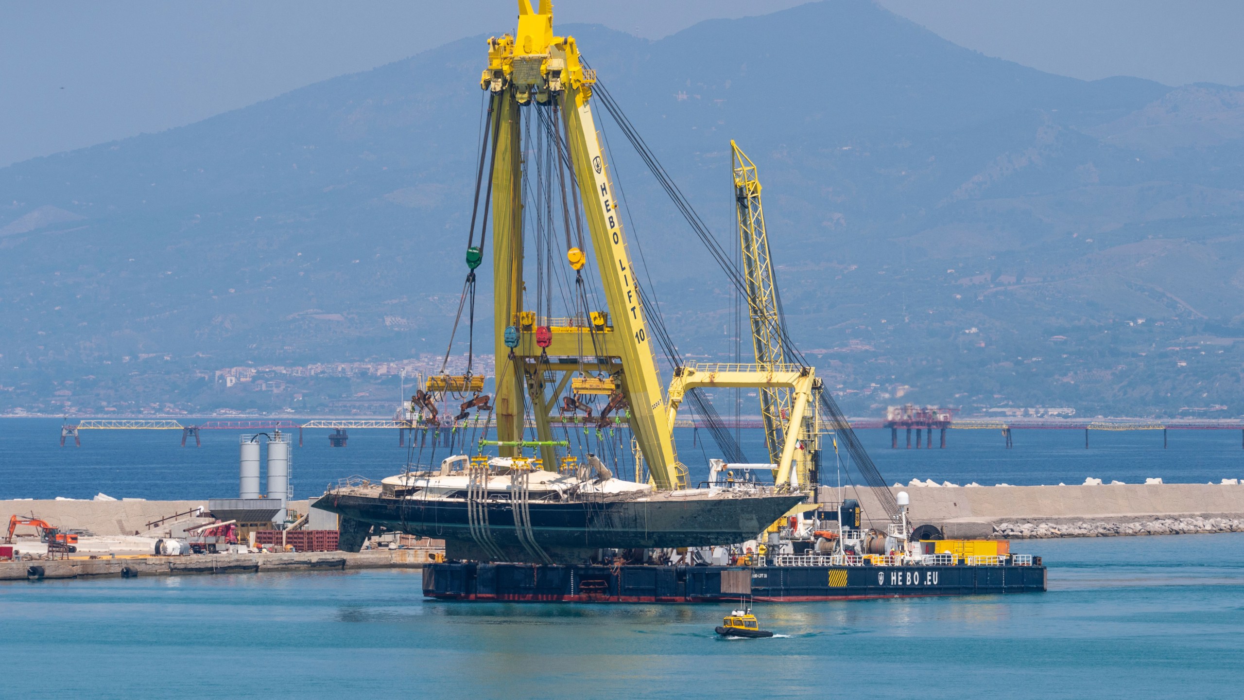 The hull of the superyacht Bayesian, which sank near Palermo, Sicily, on August 19, 2024, is taken to the shipyard in Termini Imerese, Sunday, June 22, 2025. (AP Photo/Salvatore Cavalli)
