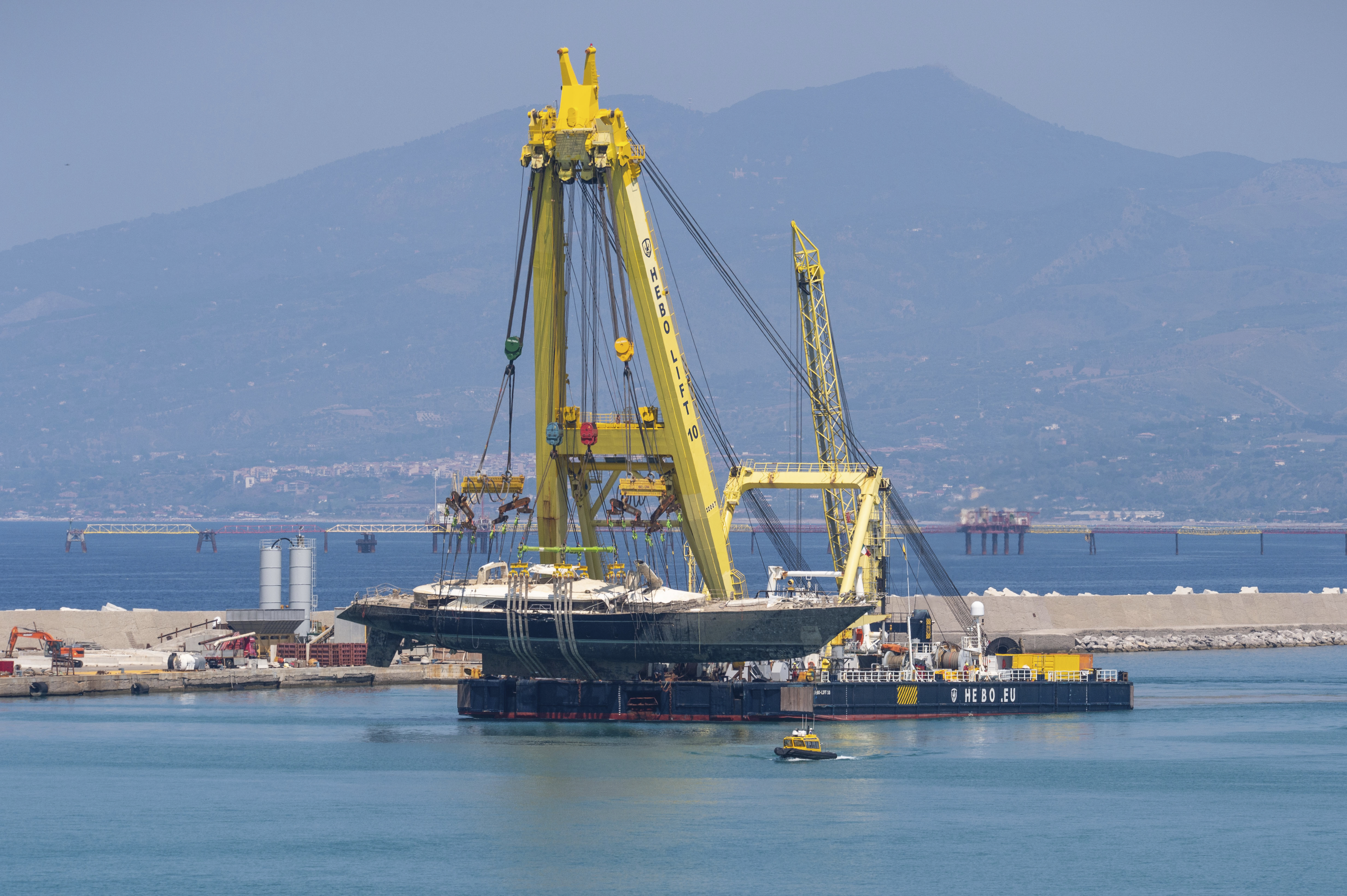 The hull of the superyacht Bayesian, which sank near Palermo, Sicily, on August 19, 2024, is taken to the shipyard in Termini Imerese, Sunday, June 22, 2025. (AP Photo/Salvatore Cavalli)