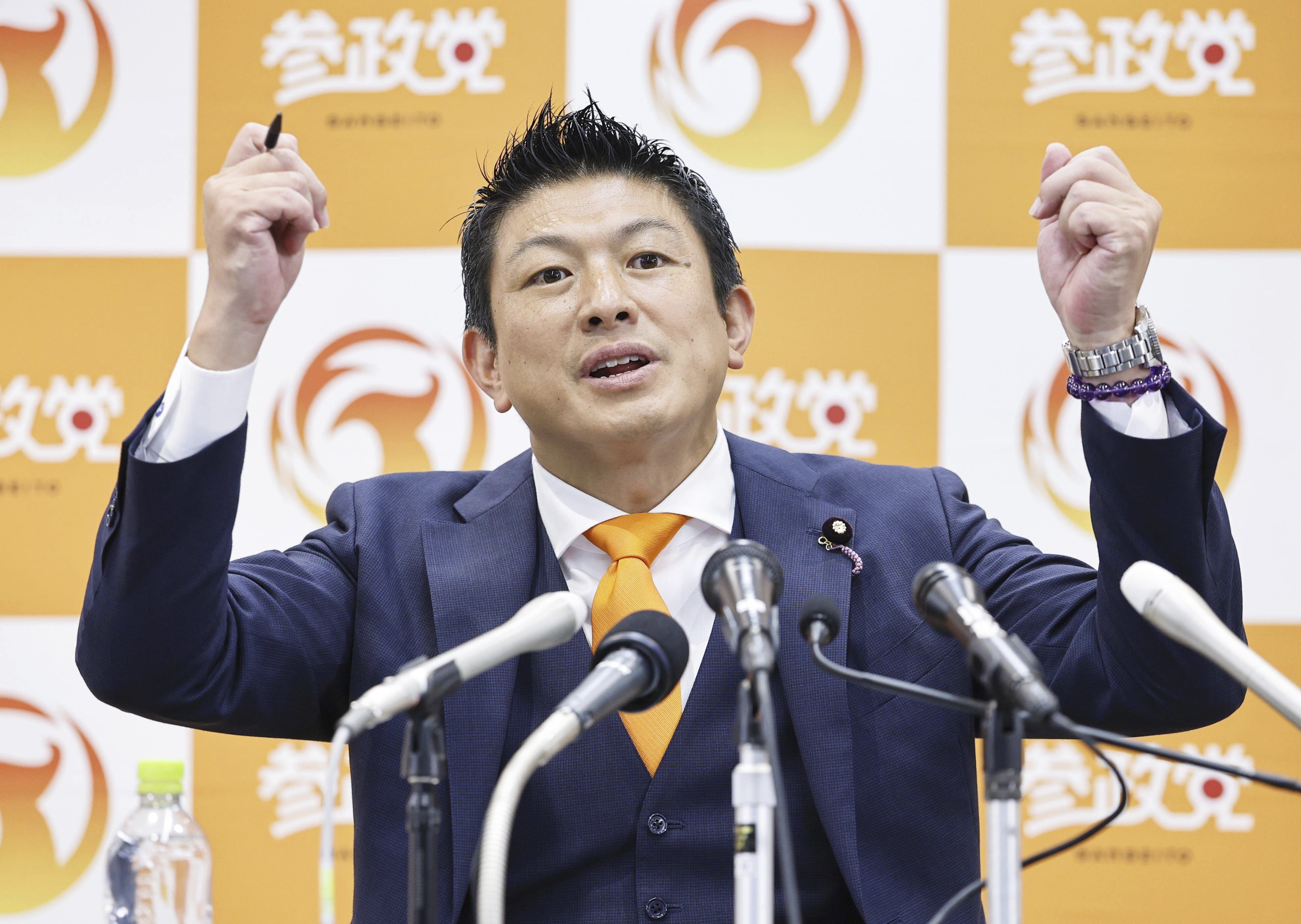 Sohei Kamiya, leader of Sanseito party speaks to the media following the upper house election in Tokyo, Sunday, July 20, 2025. (Kyodo News via AP)