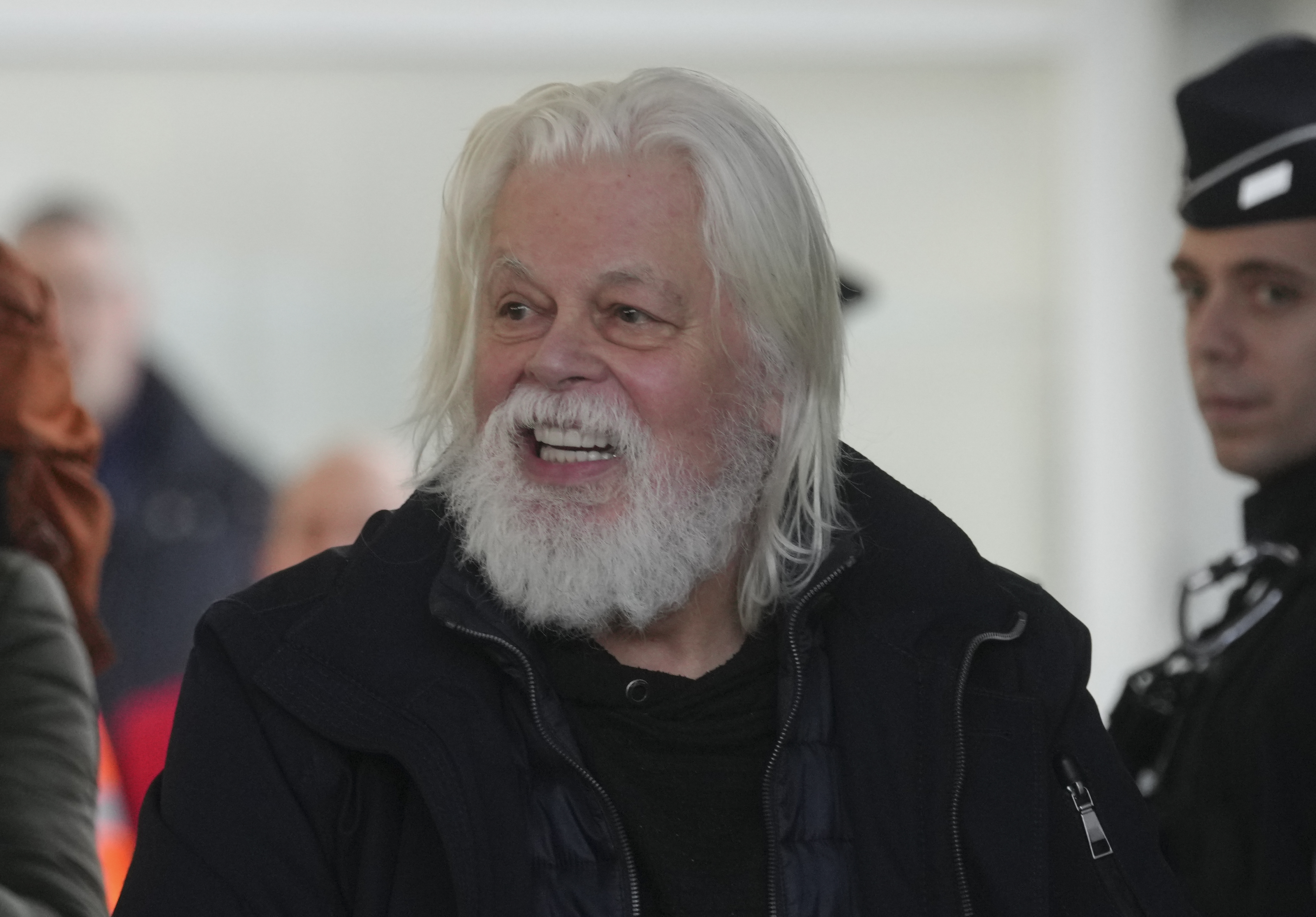 FILE - Environmental activist Paul Watson smiles as he arrives at Charles de Gaulle's airport in Roissy, north of Paris, Dec. 20, 2025 after being released from prison few days ago. (AP Photo/Thibault Camus, file)