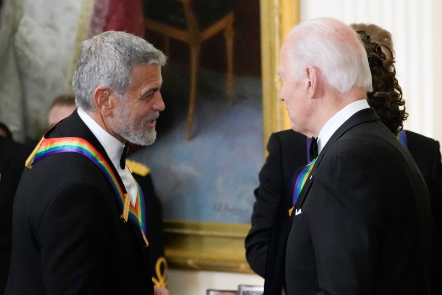 FILE - President Joe Biden shakes hands with actor, director and producer George Clooney during the Kennedy Center honorees reception at the White House in Washington, Dec. 4, 2022. (AP Photo/Manuel Balce Ceneta, File)