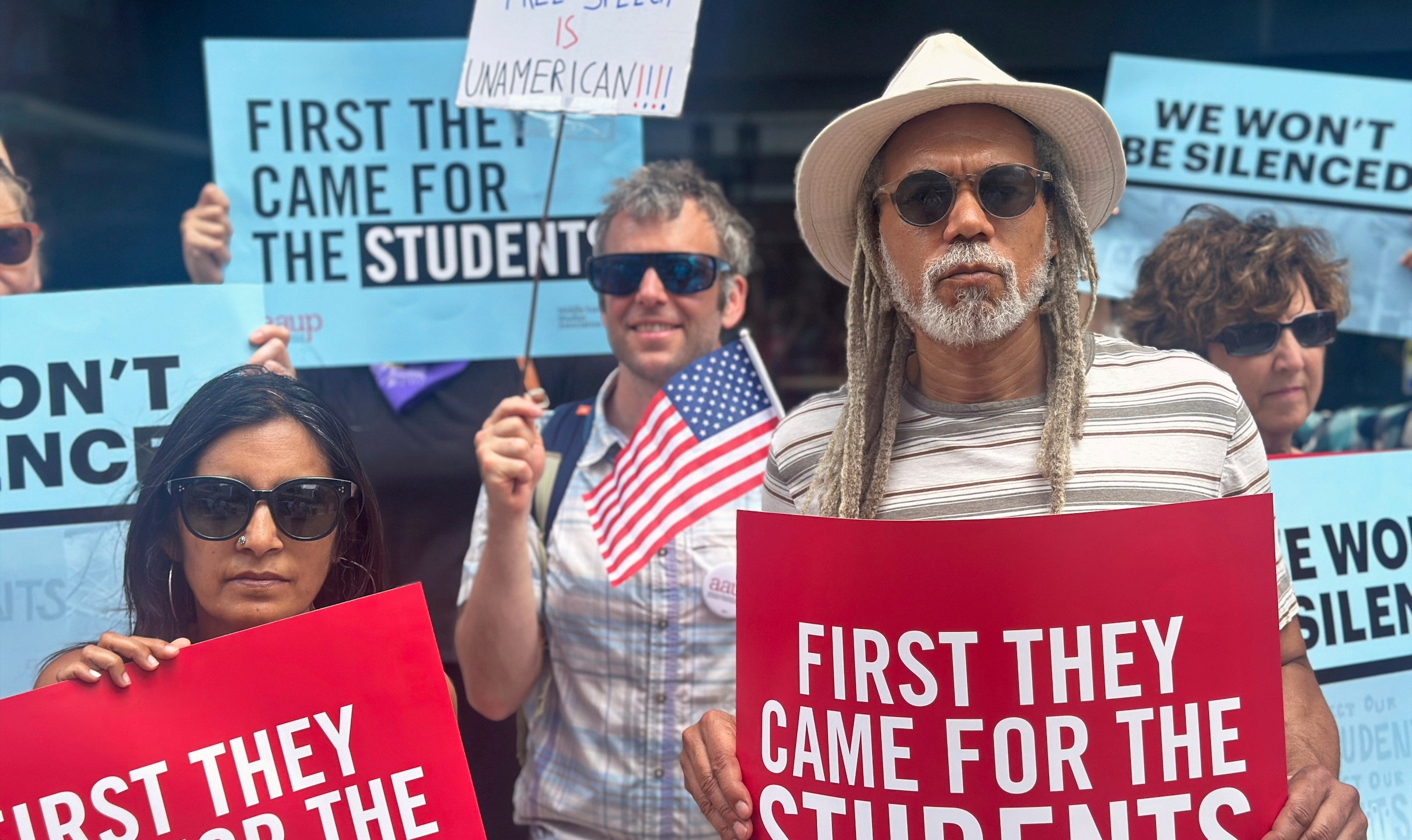 FILE - People show their support for a lawsuit challenging the Trump administration's policy of targeting students for deportation who took part in pro-Palestinian demonstrations on July 7, 2025, at the federal courthouse in Boston. (AP Photo/Michael Casey, file)