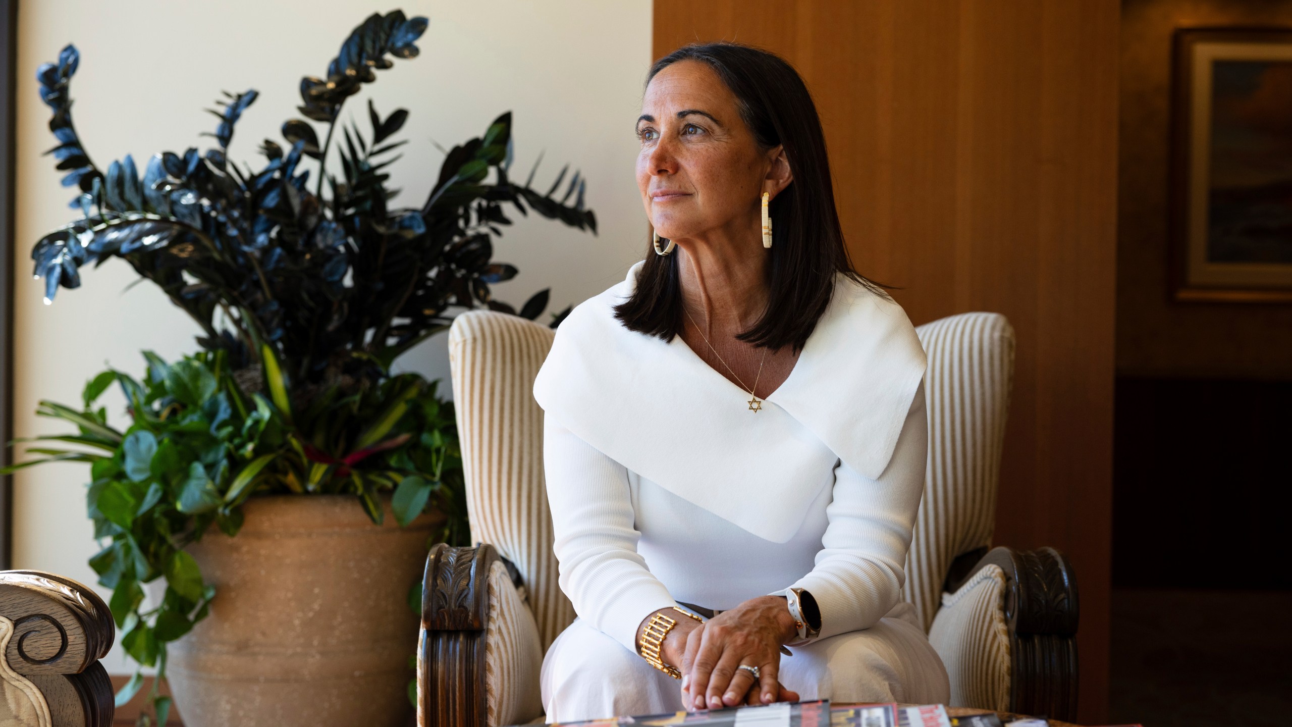 President of Samueli Family Philanthropies Lindsey Spindle sits outside of her office in Corona Del Mar, Calif., Monday, July 7, 2025. (AP Photo/Zoë Meyers)