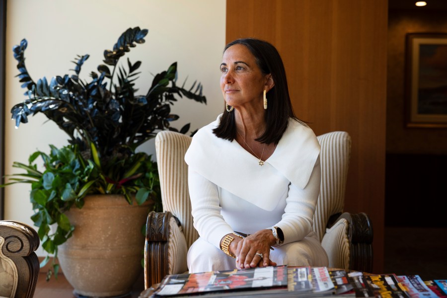 President of Samueli Family Philanthropies Lindsey Spindle sits outside of her office in Corona Del Mar, Calif., Monday, July 7, 2025. (AP Photo/Zoë Meyers)
