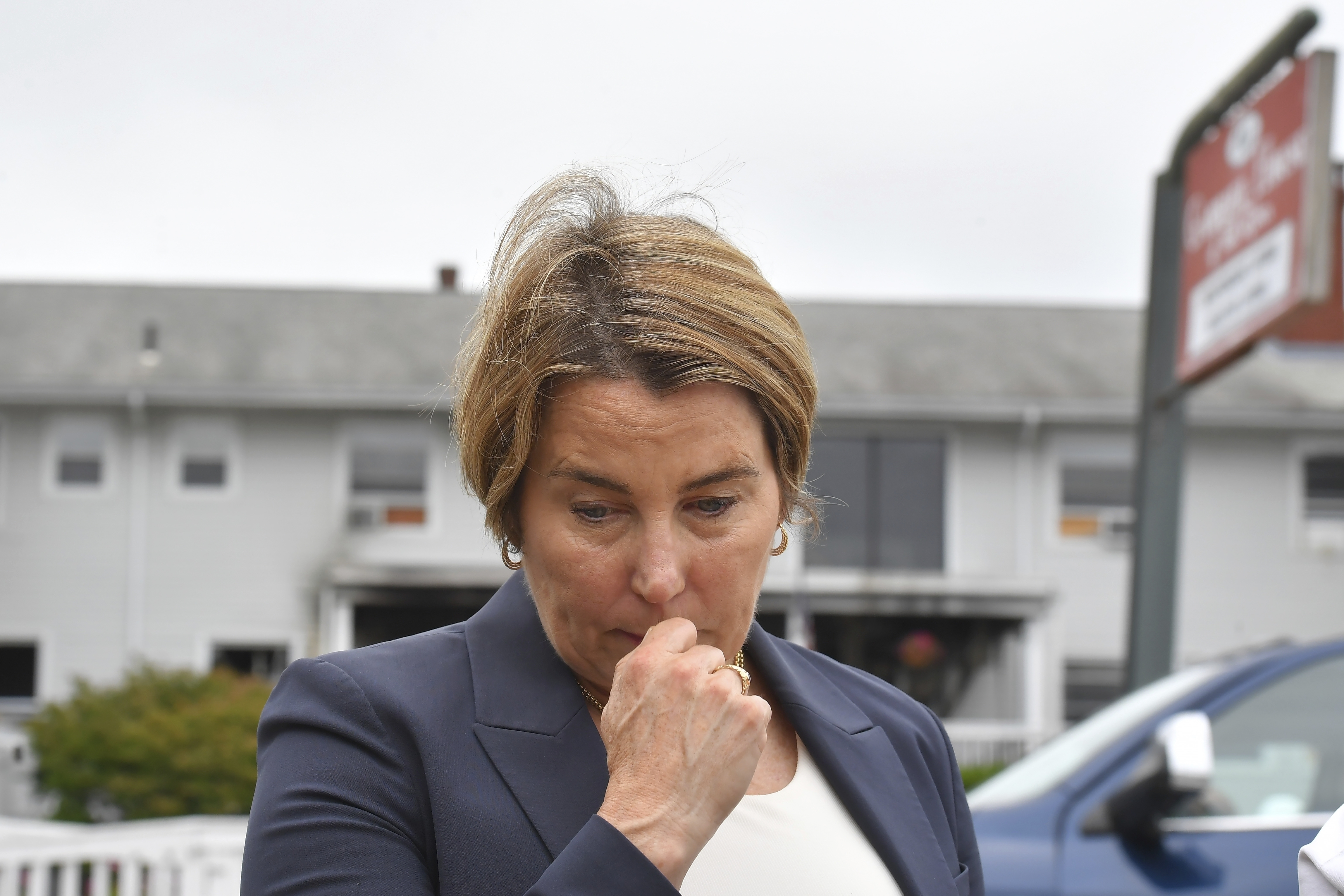 FILE - Massachusetts Gov. Maura Healey approaches a news conference to face reporters, July 14, 2025, near the Gabriel House assisted living facility, behind, following a fire that started late Sunday in Fall River, Mass. (AP Photo/Steven Senne, file)