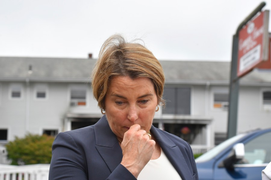 FILE - Massachusetts Gov. Maura Healey approaches a news conference to face reporters, July 14, 2025, near the Gabriel House assisted living facility, behind, following a fire that started late Sunday in Fall River, Mass. (AP Photo/Steven Senne, file)