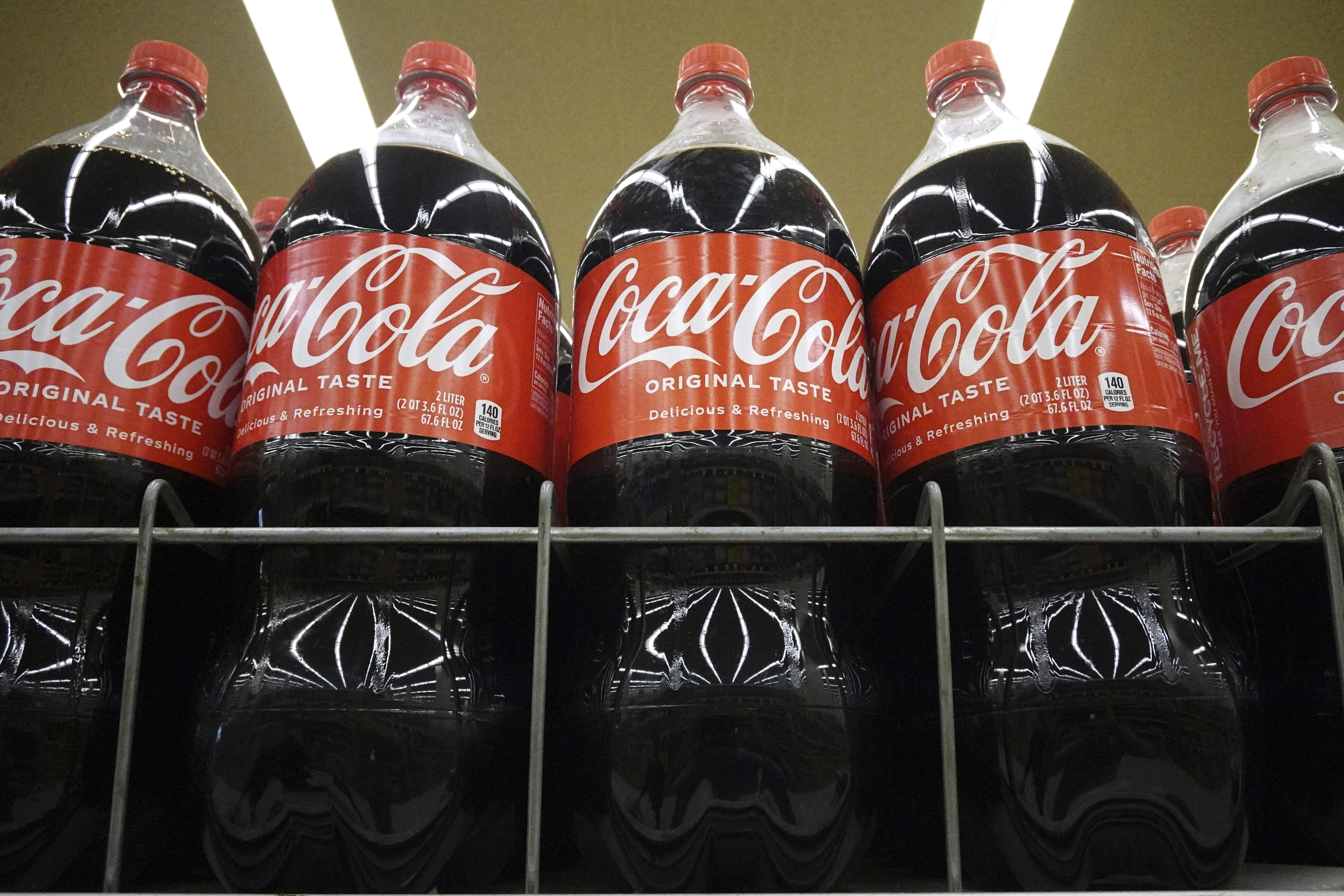 Bottles of Coca-Cola are displayed at a grocery store in Mount Prospect, Ill., Thursday, July 17, 2025. (AP Photo/Nam Y. Huh)