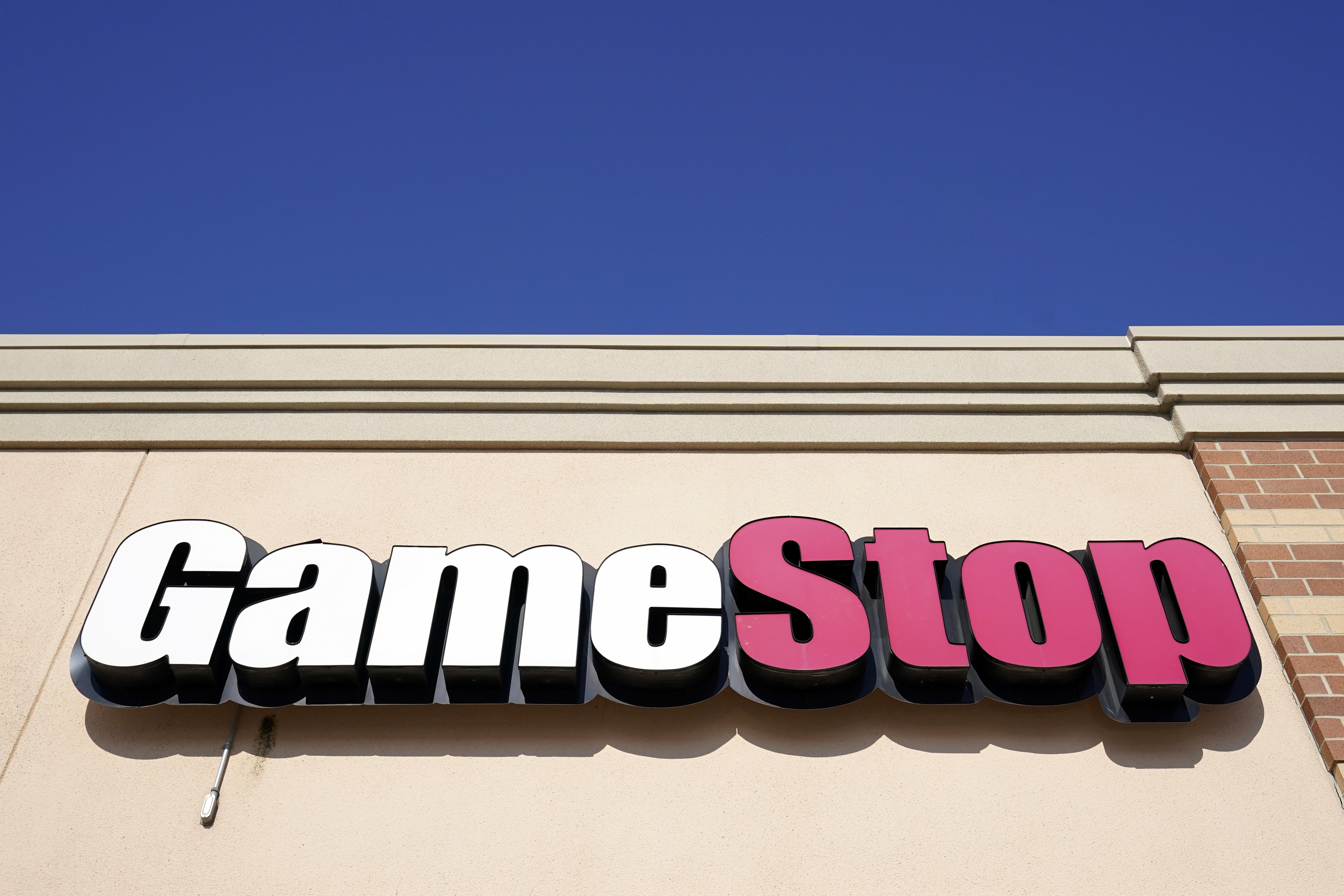 FILE - In this file photo, a GameStop sign is displayed above a store in Urbandale, Iowa, on Jan. 28, 2021. (AP Photo/Charlie Neibergall, File)