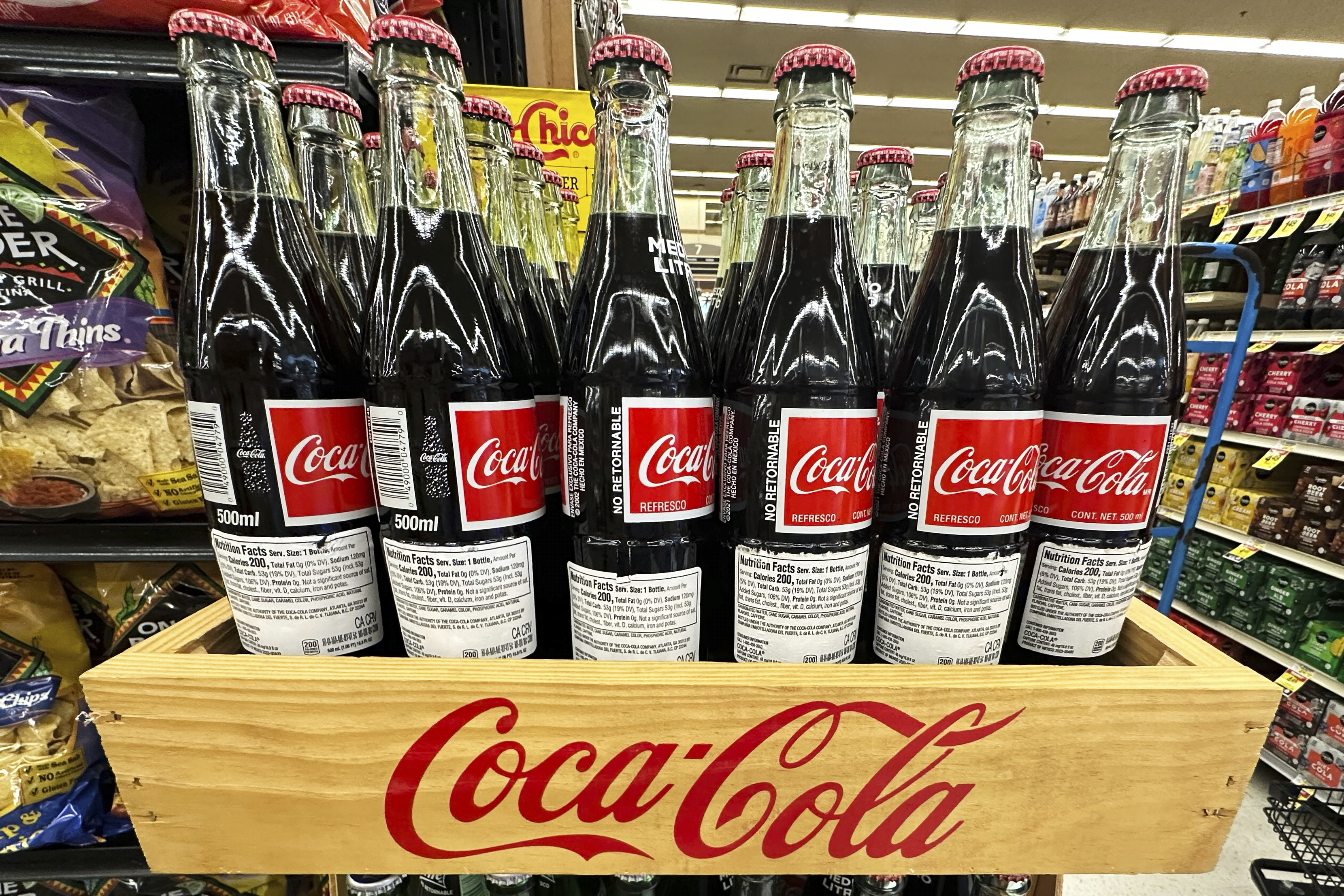 Bottles of Mexican Coca-Cola are displayed at a grocery store in Mount Prospect, Ill., Thursday, July 17, 2025. (AP Photo/Nam Y. Huh)