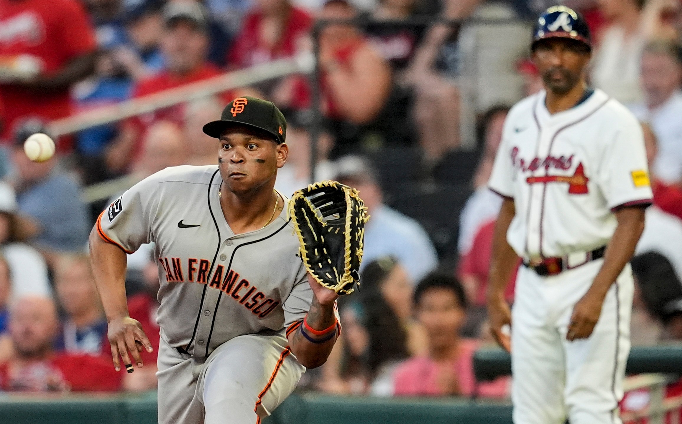 San Francisco Giants' Rafael Devers (16) makes the tag on Atlanta Braves' Nick Allen (2) at first base in the fifth inning of a baseball game, Tuesday, July 22, 2025, in Atlanta. (AP Photo/Mike Stewart)