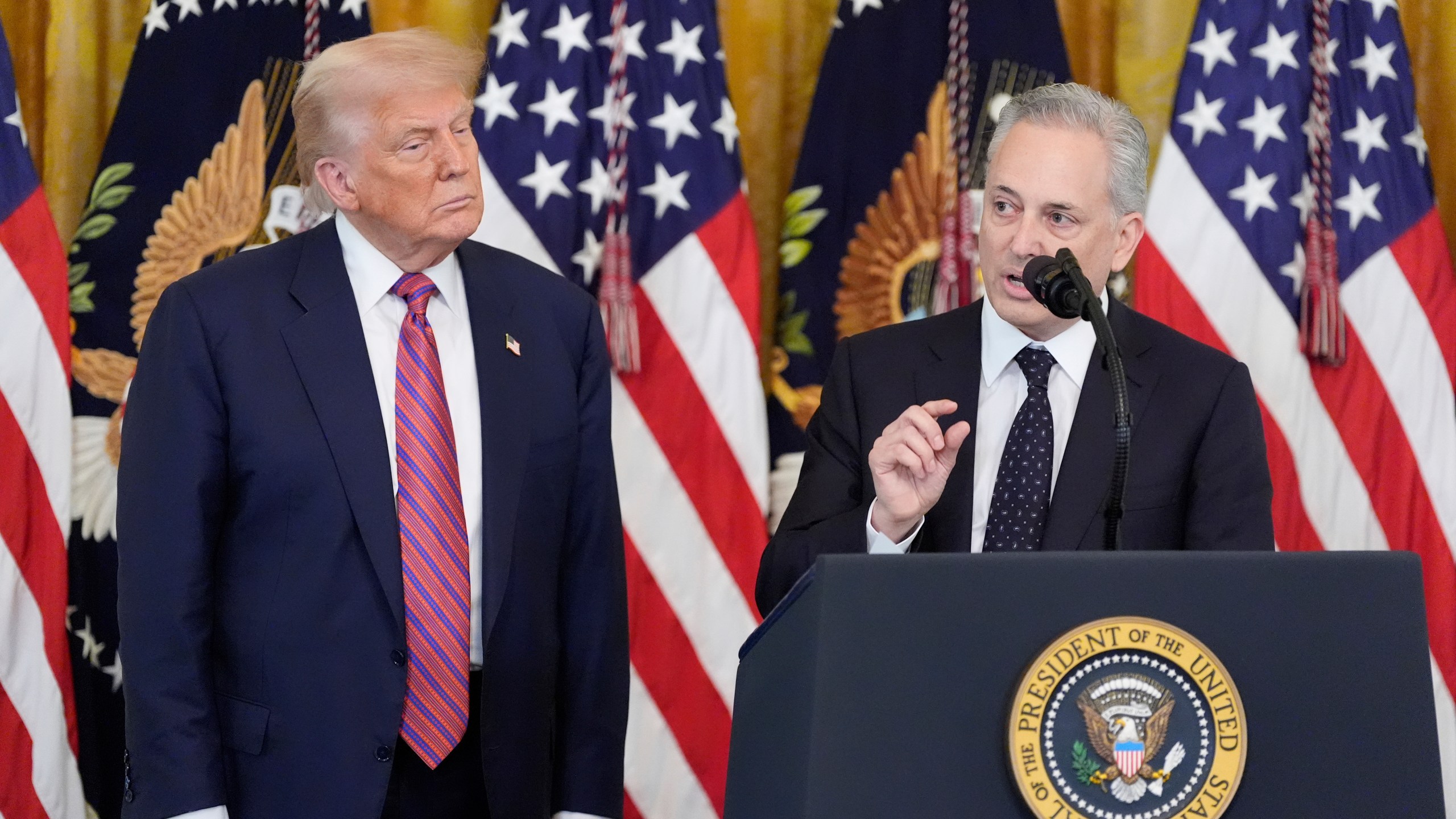 White House AI and crypto czar David Sacks speaks as President Donald Trump listens at an event for the signing of the GENIUS Act, a bill that regulates stablecoins, a type of cryptocurrency, in the East Room of the White House, Friday, July 18, 2025, in Washington. (AP Photo/Alex Brandon)