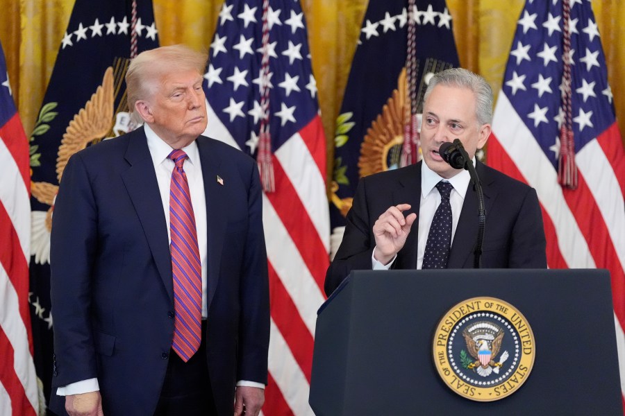 White House AI and crypto czar David Sacks speaks as President Donald Trump listens at an event for the signing of the GENIUS Act, a bill that regulates stablecoins, a type of cryptocurrency, in the East Room of the White House, Friday, July 18, 2025, in Washington. (AP Photo/Alex Brandon)