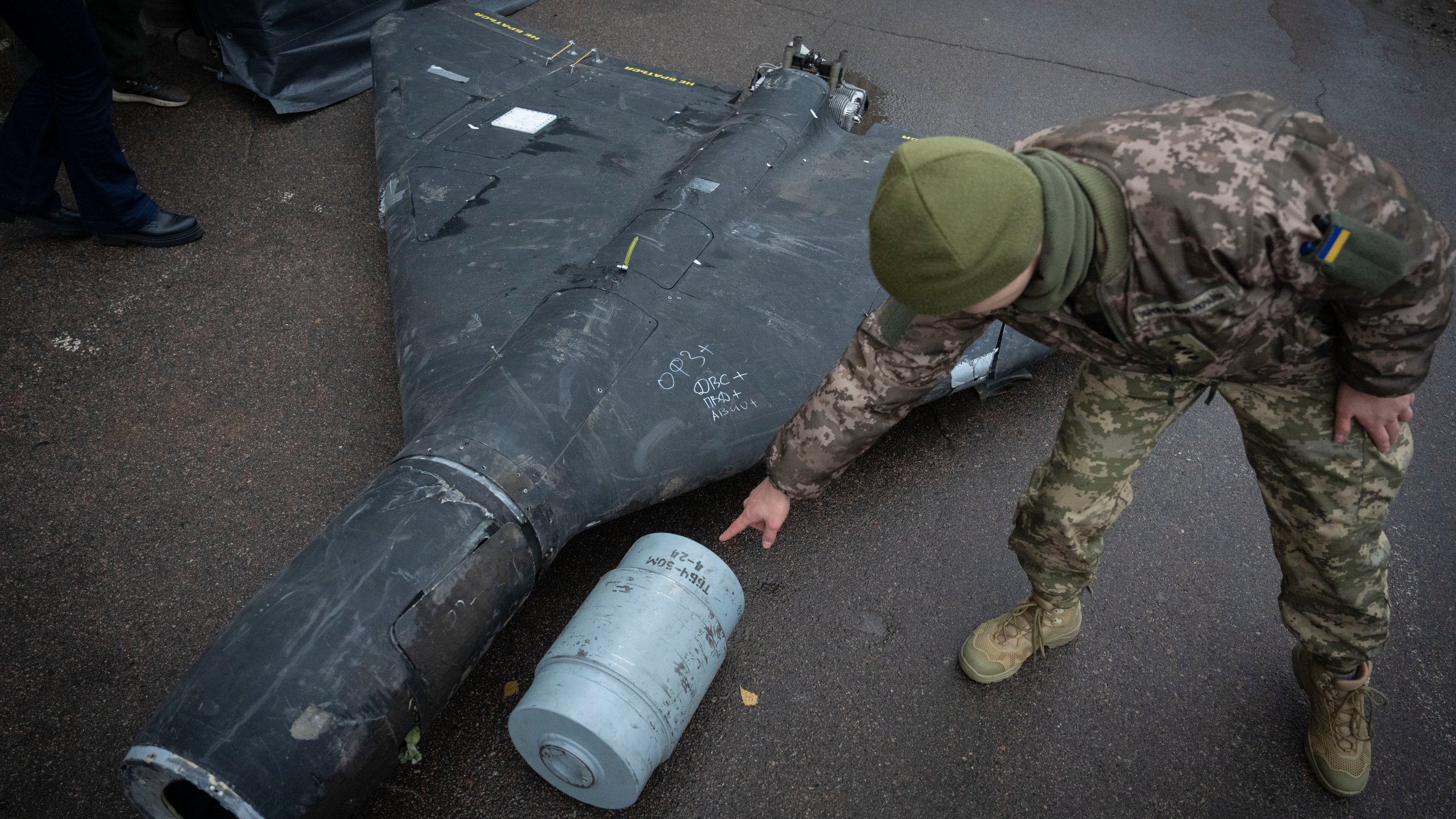 FILE - A Ukrainian officer shows a thermobaric charge from a downed Russian drone in a research laboratory in an undisclosed location in Ukraine on, Nov. 14, 2024. (AP Photo/Efrem Lukatsky, File)