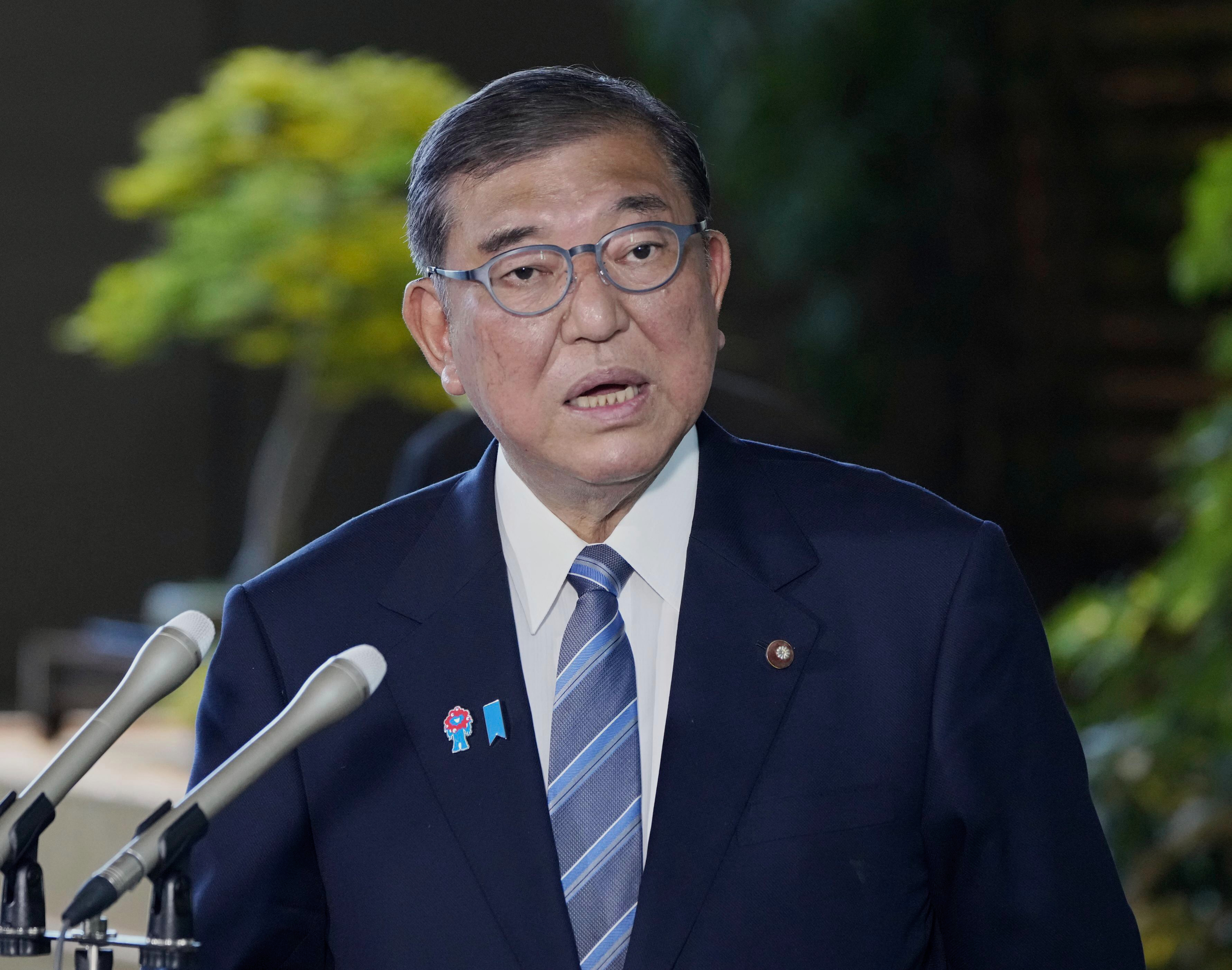 Japanese Prime Minister Shigeru Ishiba speaks to the media after President Donald Trump announced a trade framework with Japan, at the prime minister's office in Tokyo, Japan, Wednesday, July 23, 2025. (Kyodo News via AP)