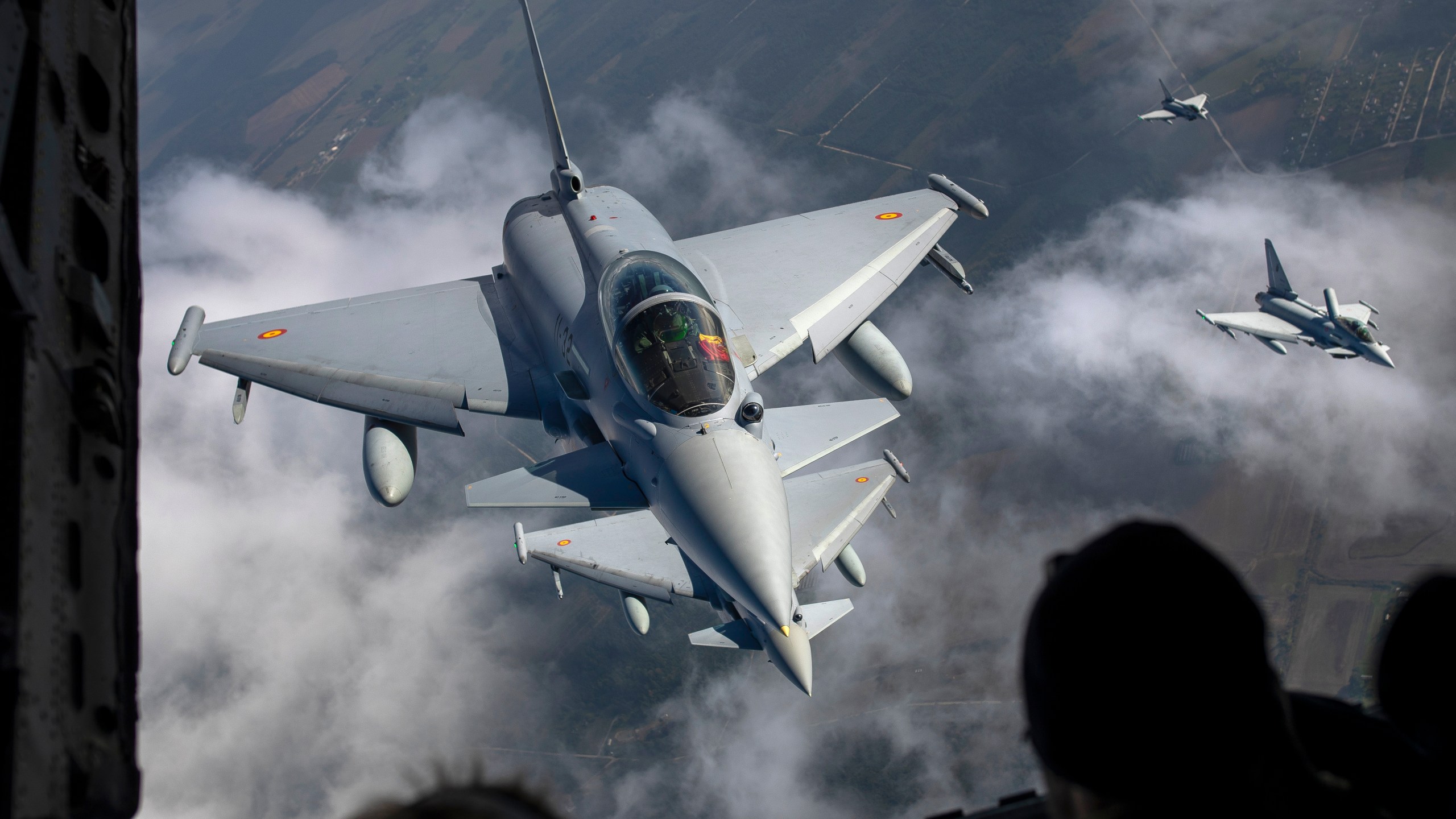 FILE -Spanish Air Force Eurofighter Typhoon military fighter jets, left, and Italian Air Force Eurofighter Typhoon military fighter jets, right, participating in NATO's Baltic Air Policing Mission operate in Lithuanian airspace,, Sept.12, 2023. (AP Photo/Mindaugas Kulbis, File)
