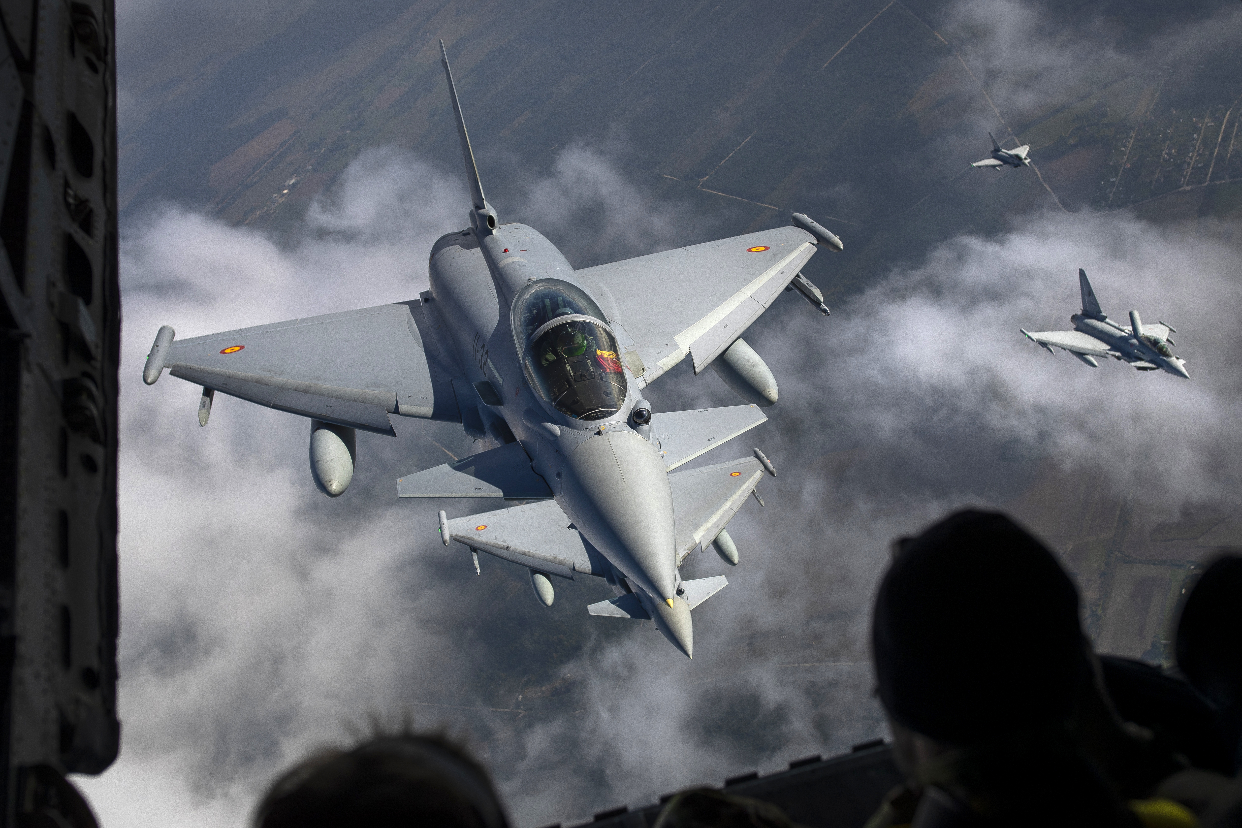 FILE -Spanish Air Force Eurofighter Typhoon military fighter jets, left, and Italian Air Force Eurofighter Typhoon military fighter jets, right, participating in NATO's Baltic Air Policing Mission operate in Lithuanian airspace,, Sept.12, 2023. (AP Photo/Mindaugas Kulbis, File)