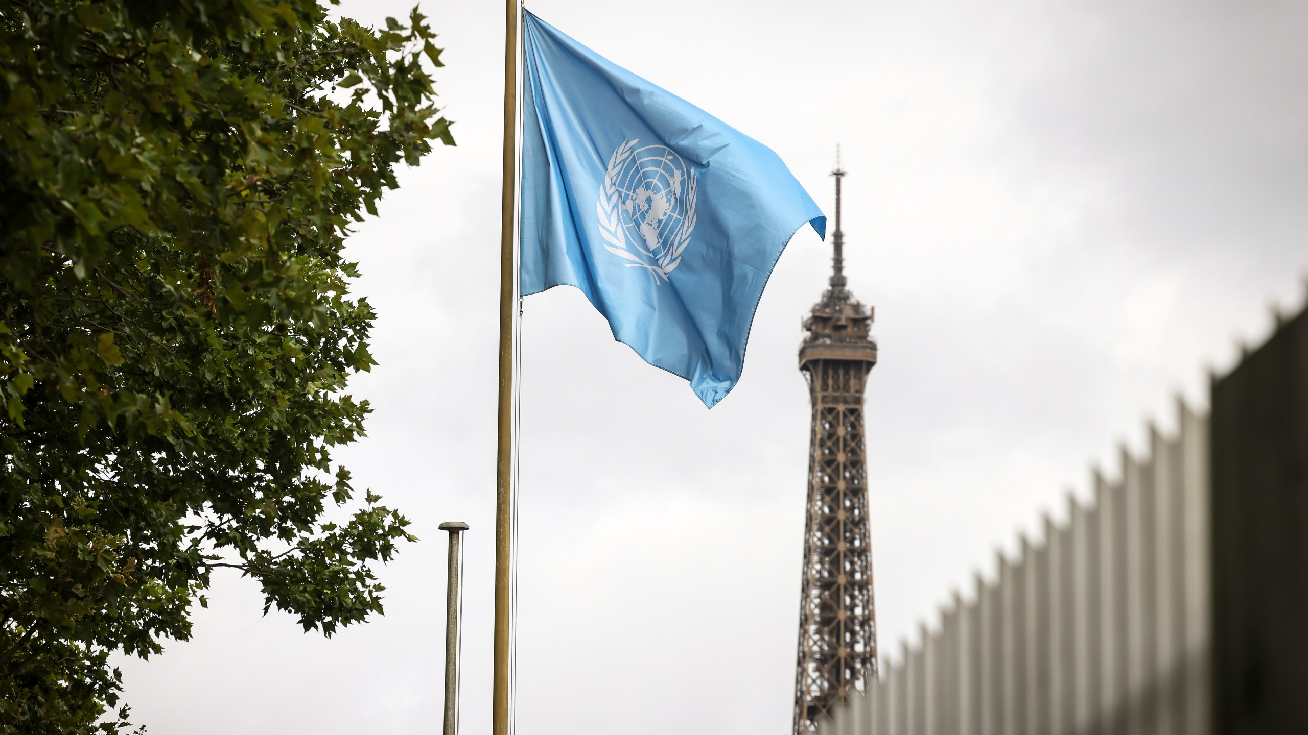The UNESCO flag flies at its headquarters Tuesday, July 22, 2025 in Paris. (AP Photo/Thomas Padilla)