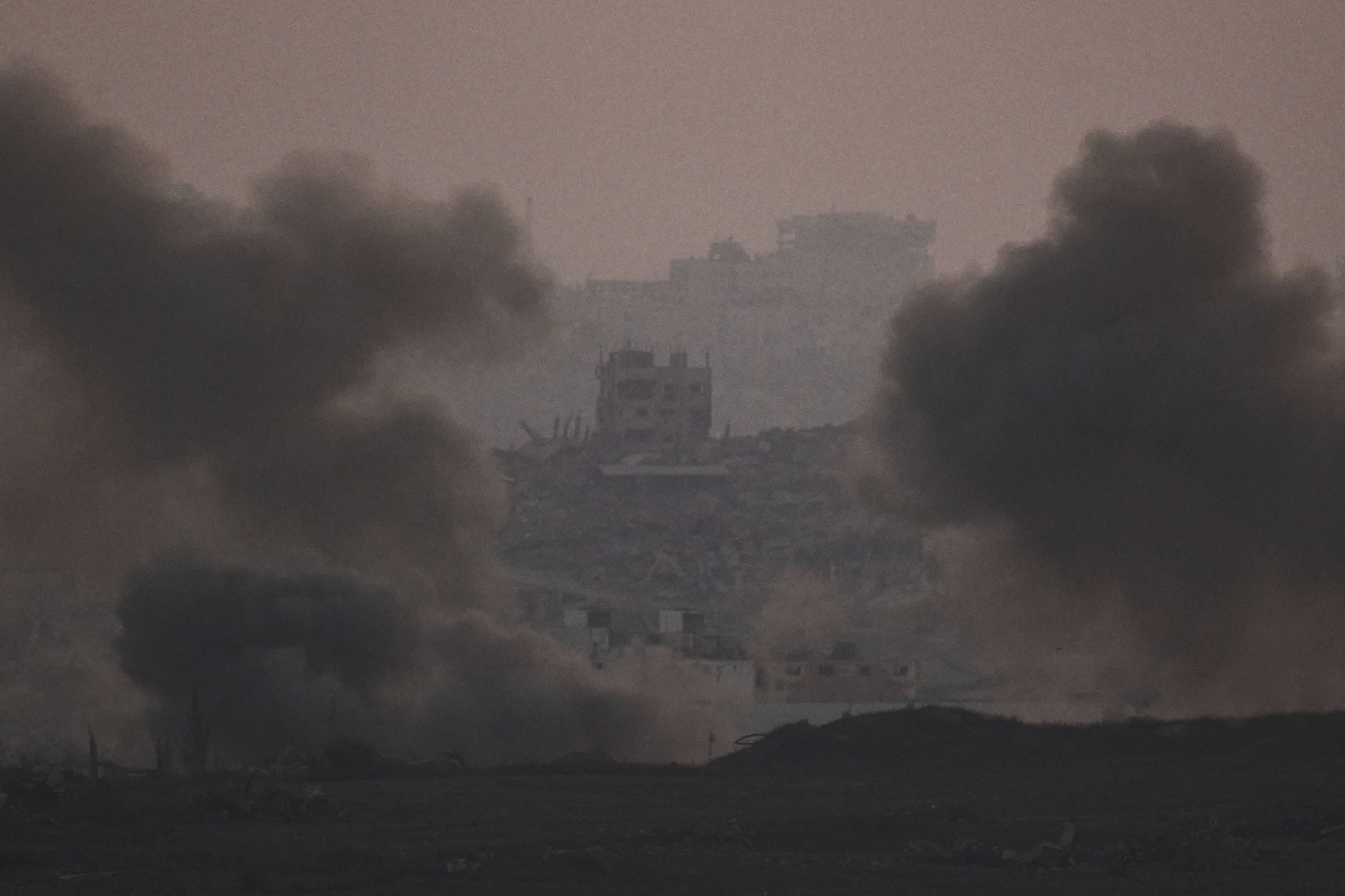 Smokes rises after an explosion during Israeli air and ground operations in the Gaza Strip as seen from southern Israel, Tuesday, July 22, 2025. (AP Photo/Leo Correa)