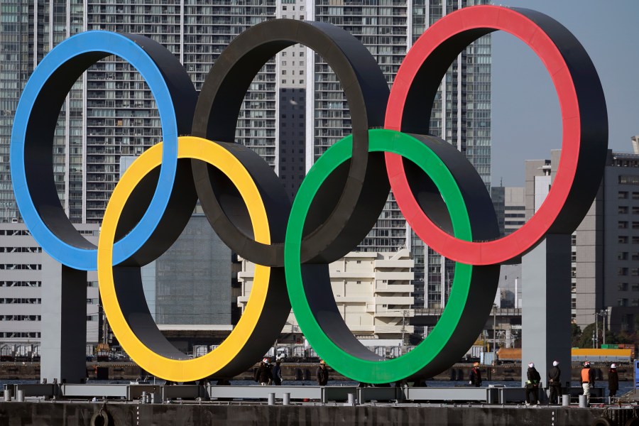 FILE - The Olympic rings are reinstalled after being taken down for maintenance ahead of the postponed Tokyo 2020 Olympics in the Odaiba section in Tokyo, Dec. 1, 2024. (AP Photo/Eugene Hoshiko, File)