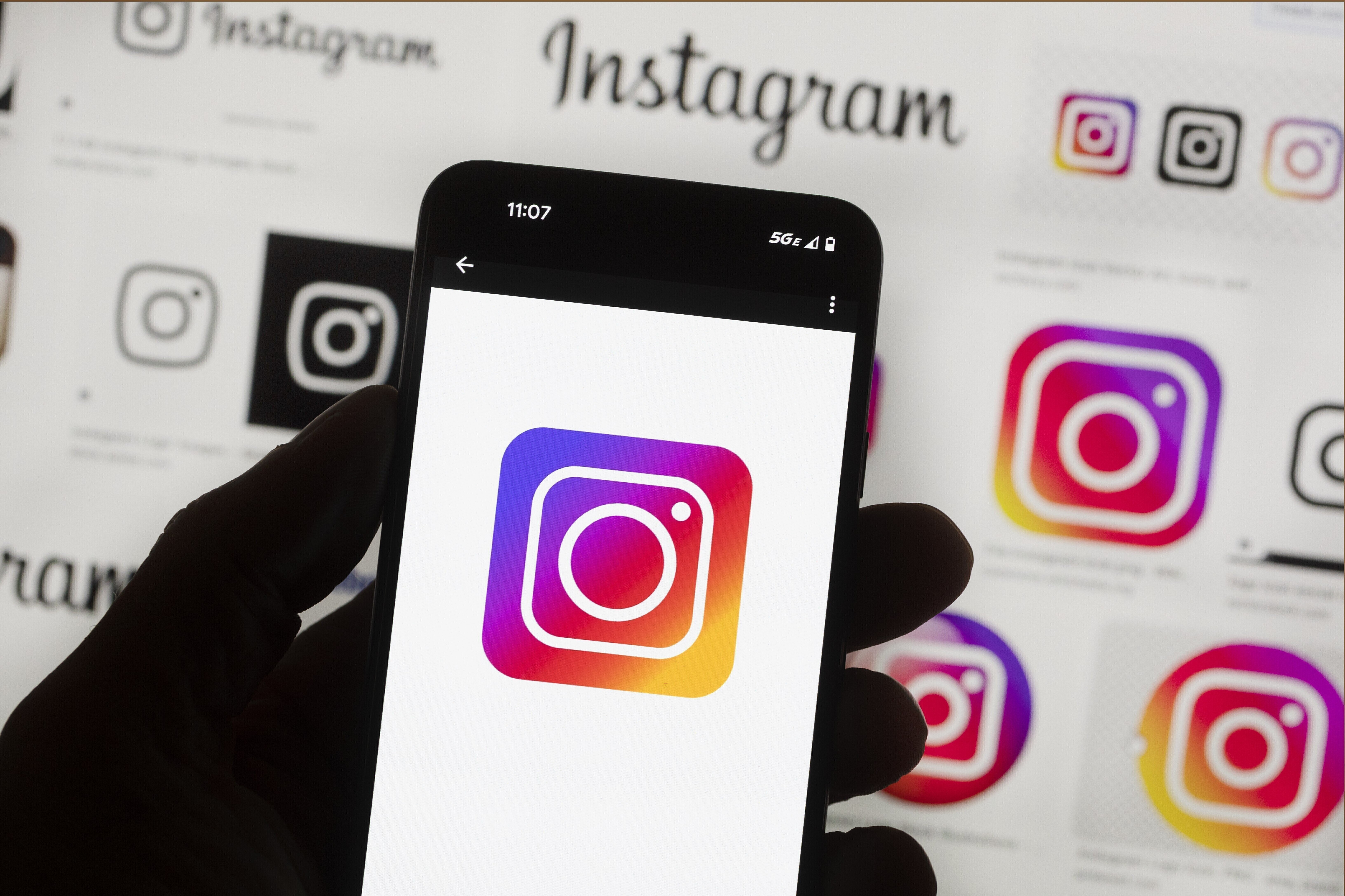 FILE - The Instagram logo is seen on a cell phone in Boston, Oct. 14, 2022. (AP Photo/Michael Dwyer, File)