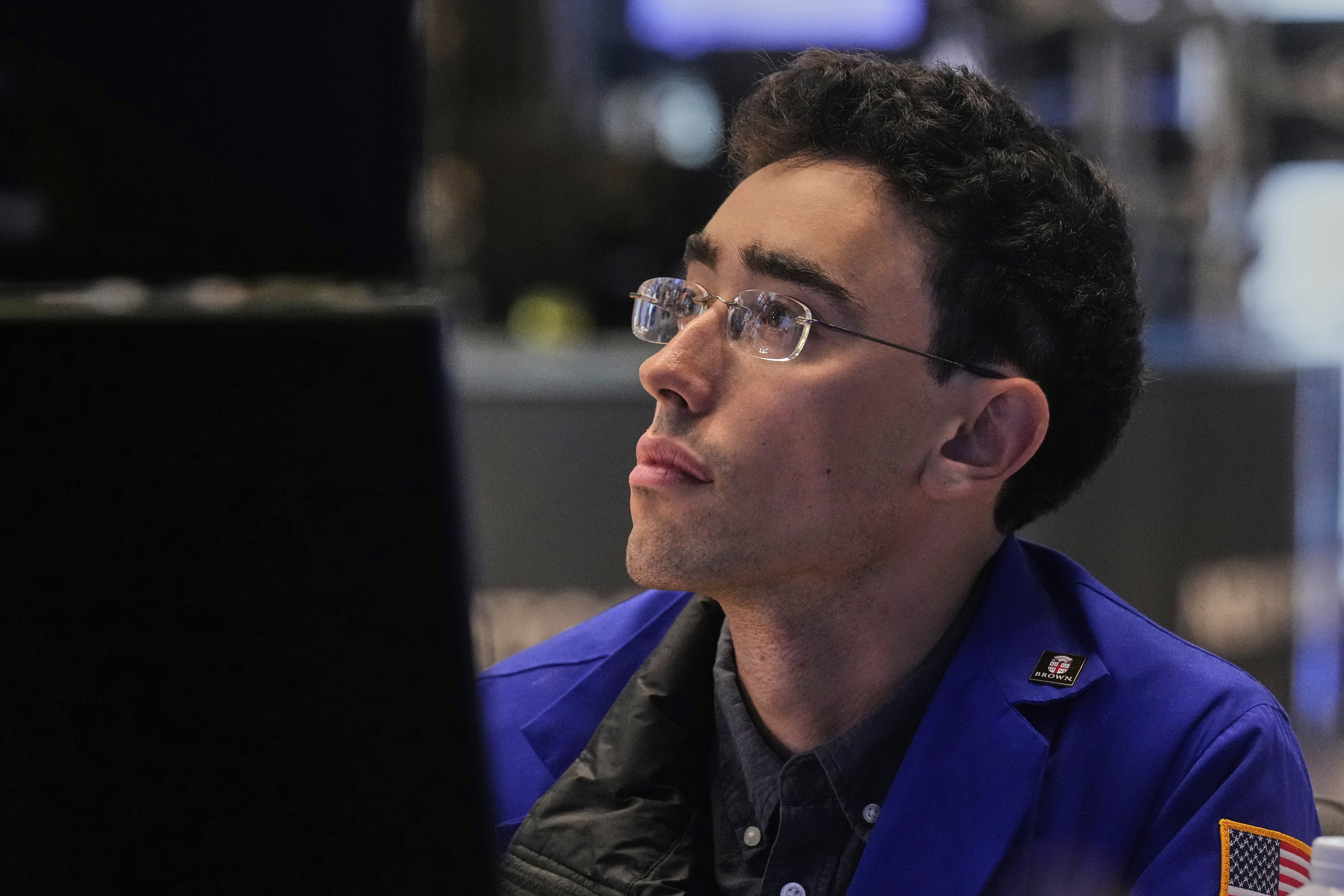 Specialist Alex Weitzman works at his post on the floor of the New York Stock Exchange, Monday, July 21, 2025. (AP Photo/Richard Drew)