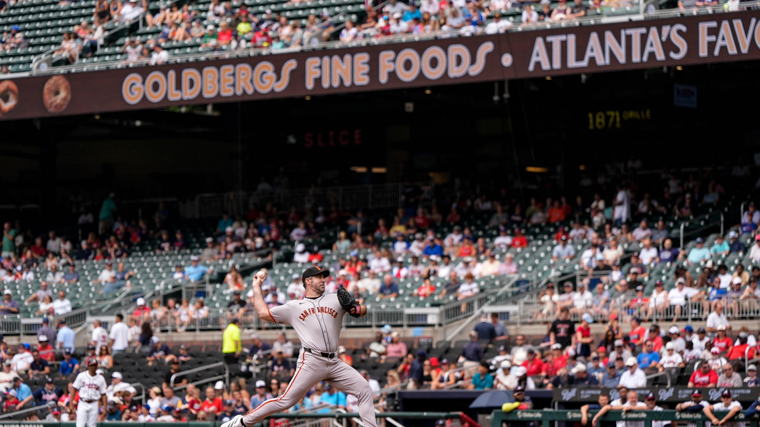 San Francisco Giants pitcher Justin Verlander (35) delivers in the first inning of a baseball game against the Atlanta Braves, Wednesday, July 23, 2025, in Atlanta. (AP Photo/Mike Stewart)