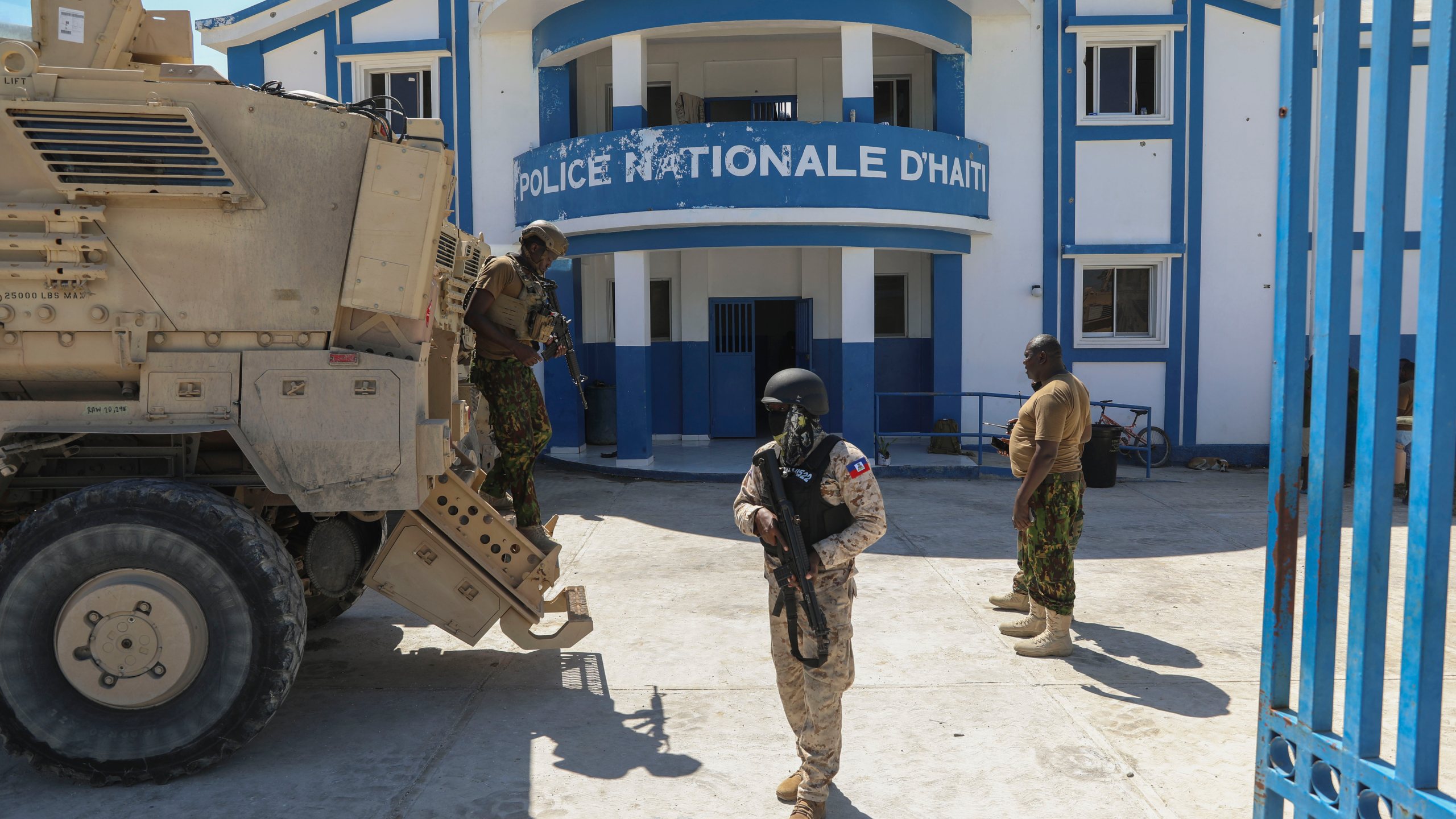 FILE - Haitian and Kenyan police who are part of a UN-backed multinational force stand at a police station in Pont-Sonde, Haiti, Oct. 7, 2024, days after a gang attacked the town. (AP Photo/Odelyn Joseph, File)