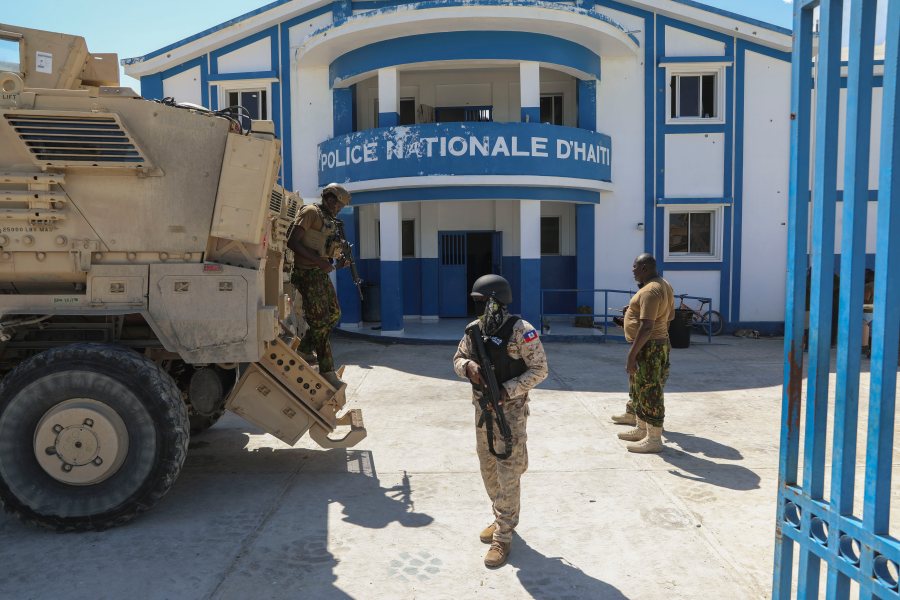 FILE - Haitian and Kenyan police who are part of a UN-backed multinational force stand at a police station in Pont-Sonde, Haiti, Oct. 7, 2024, days after a gang attacked the town. (AP Photo/Odelyn Joseph, File)