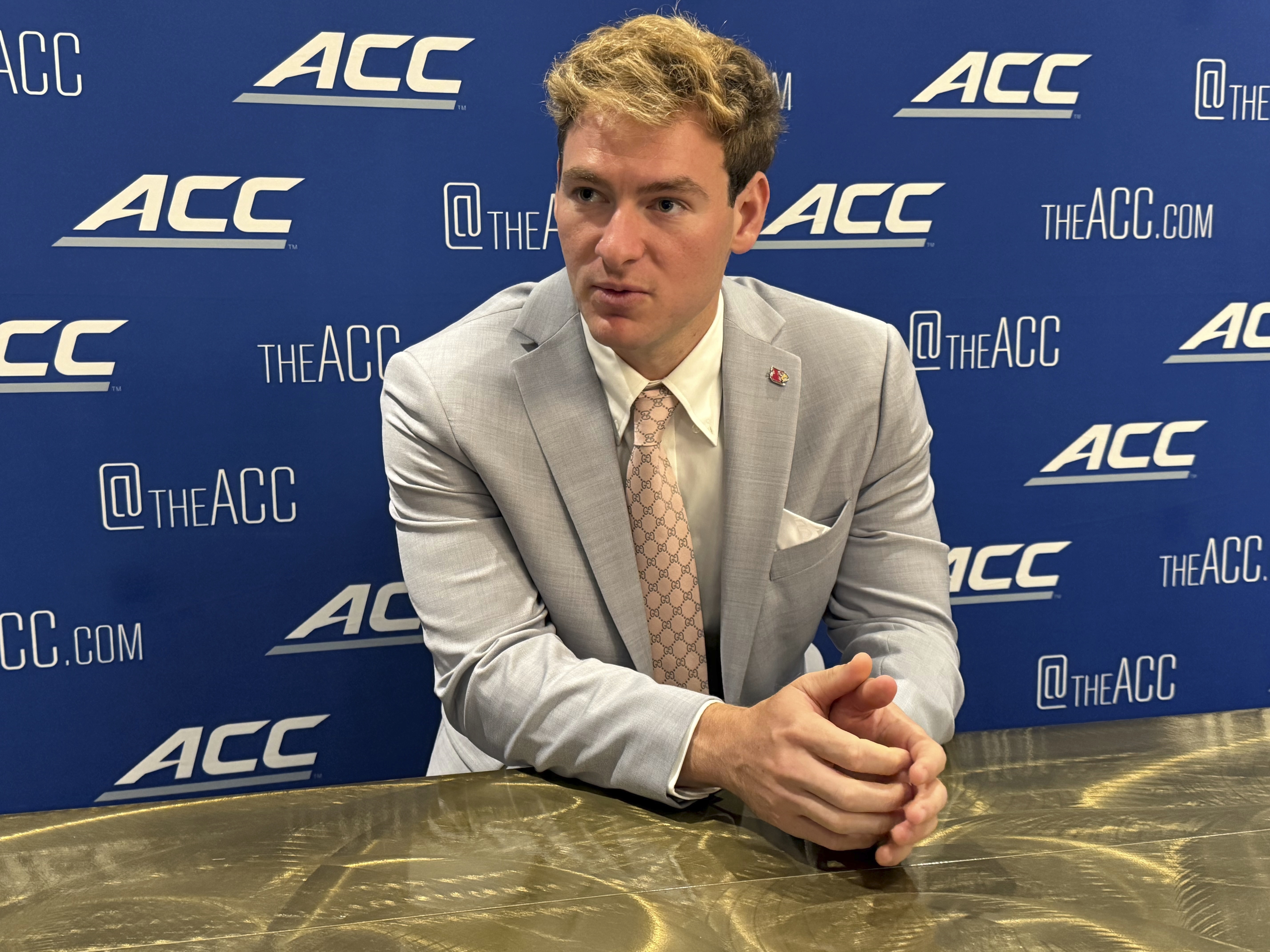 Louisville quarterback Miller Moss, a transfer from Southern California, speaks at the Atlantic Coast Conference NCAA college football media days, Wednesda, July 23, 2025, in Charlotte, N.C. (AP Photo/Steve Reed)