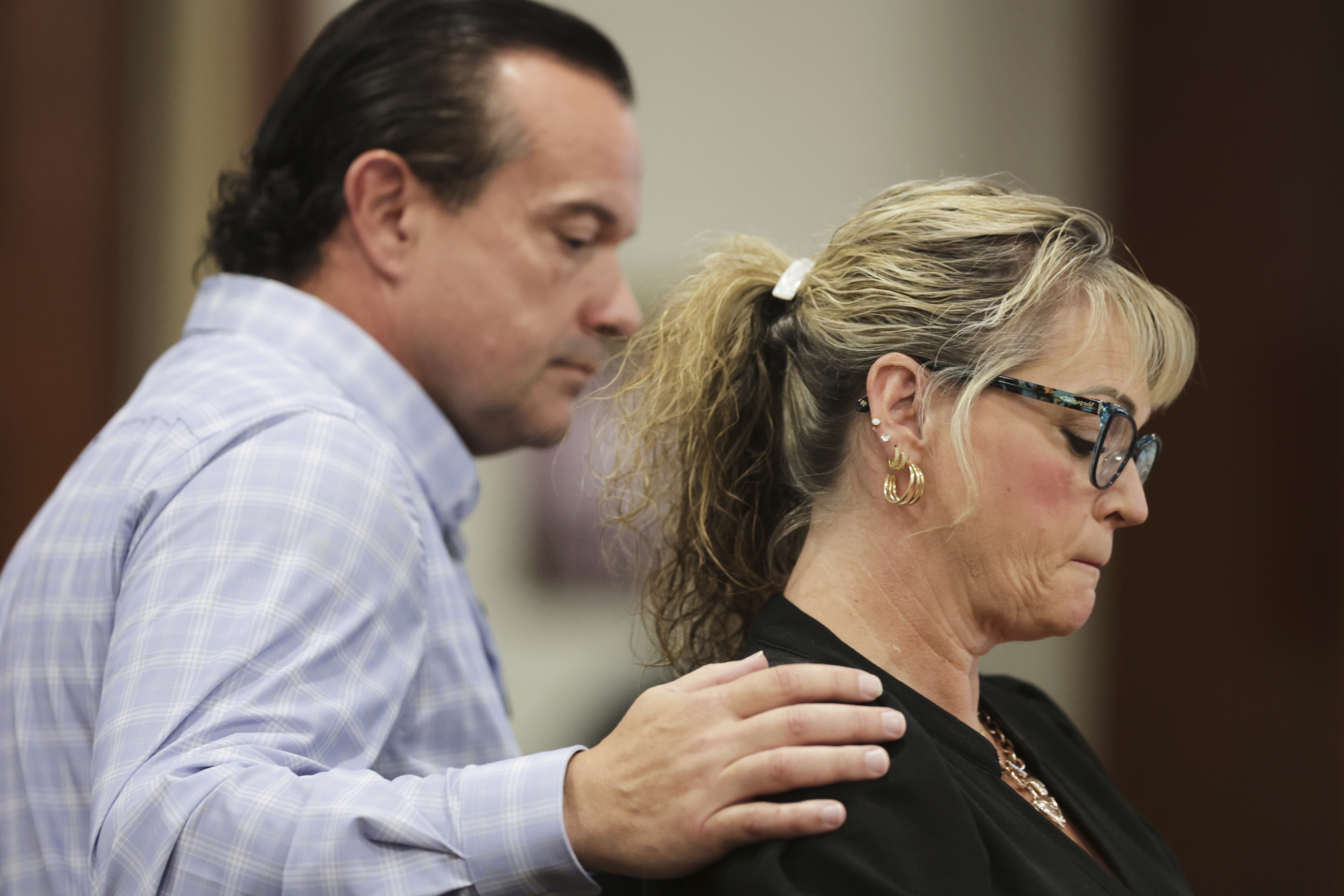 Steve Goncalves consoles Kristi Goncalves, mother of victim Kaylee Goncalves speaks at the sentencing hearing of Bryan Kohberger at the Ada County Courthouse, Wednesday, July 23, 2025, in Boise, Idaho, for brutally stabbing four University of Idaho students to death nearly three years ago. (AP Photo/Kyle Green, Pool)