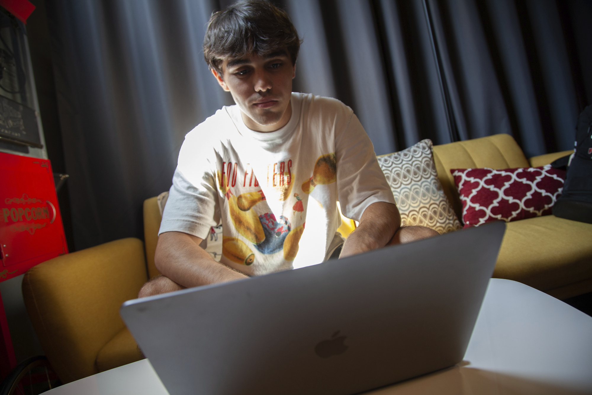Bruce Perry, 17, demonstrates using artificial intelligence software on his laptop during a break from summer camp Tuesday, July 15, 2025, in Russellville, Ark. (AP Photo/Katie Adkins)