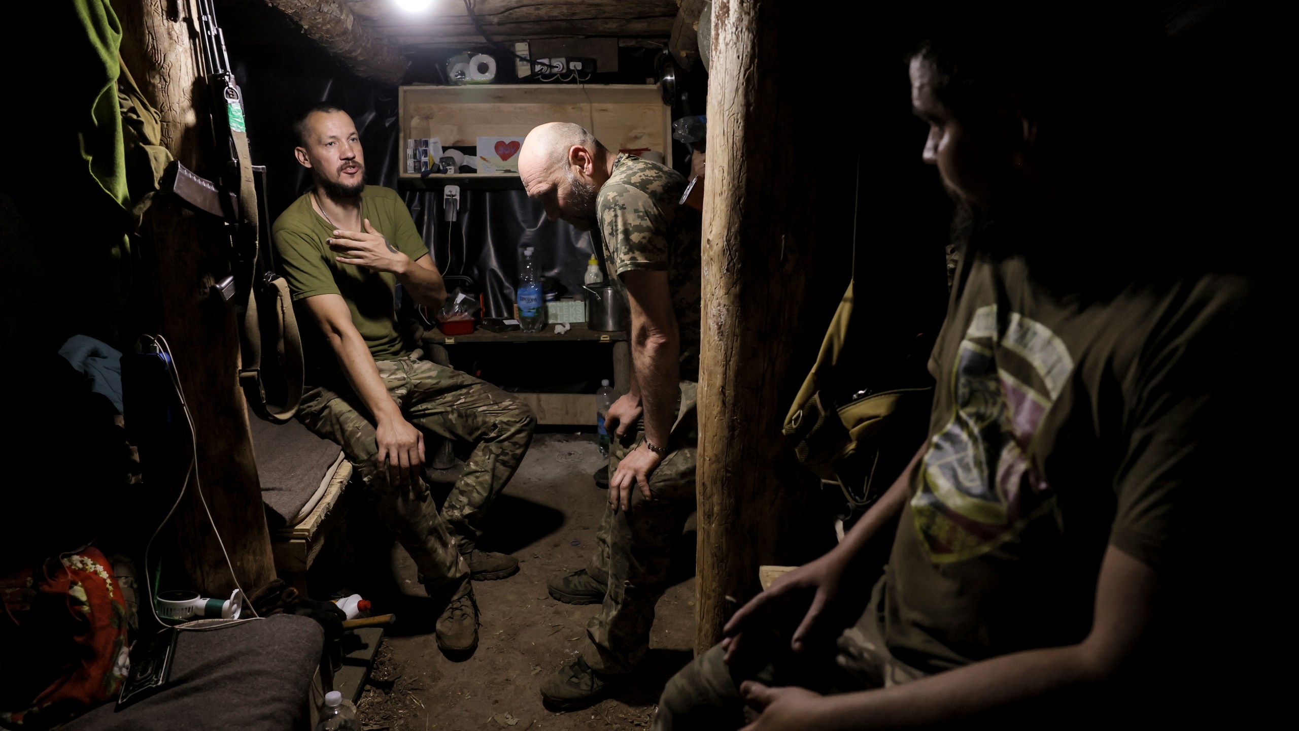 In this photo and provided by Ukraine's 24th Mechanized Brigade press service, soldiers have a rest in a shelter on the frontline near Chasiv Yar, Donetsk region, Ukraine, Tuesday, July 22, 2025. (Oleg Petrasiuk/Ukraine's 24th Mechanized Brigade via AP)
