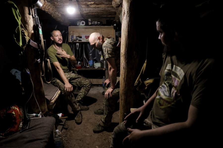 In this photo and provided by Ukraine's 24th Mechanized Brigade press service, soldiers have a rest in a shelter on the frontline near Chasiv Yar, Donetsk region, Ukraine, Tuesday, July 22, 2025. (Oleg Petrasiuk/Ukraine's 24th Mechanized Brigade via AP)