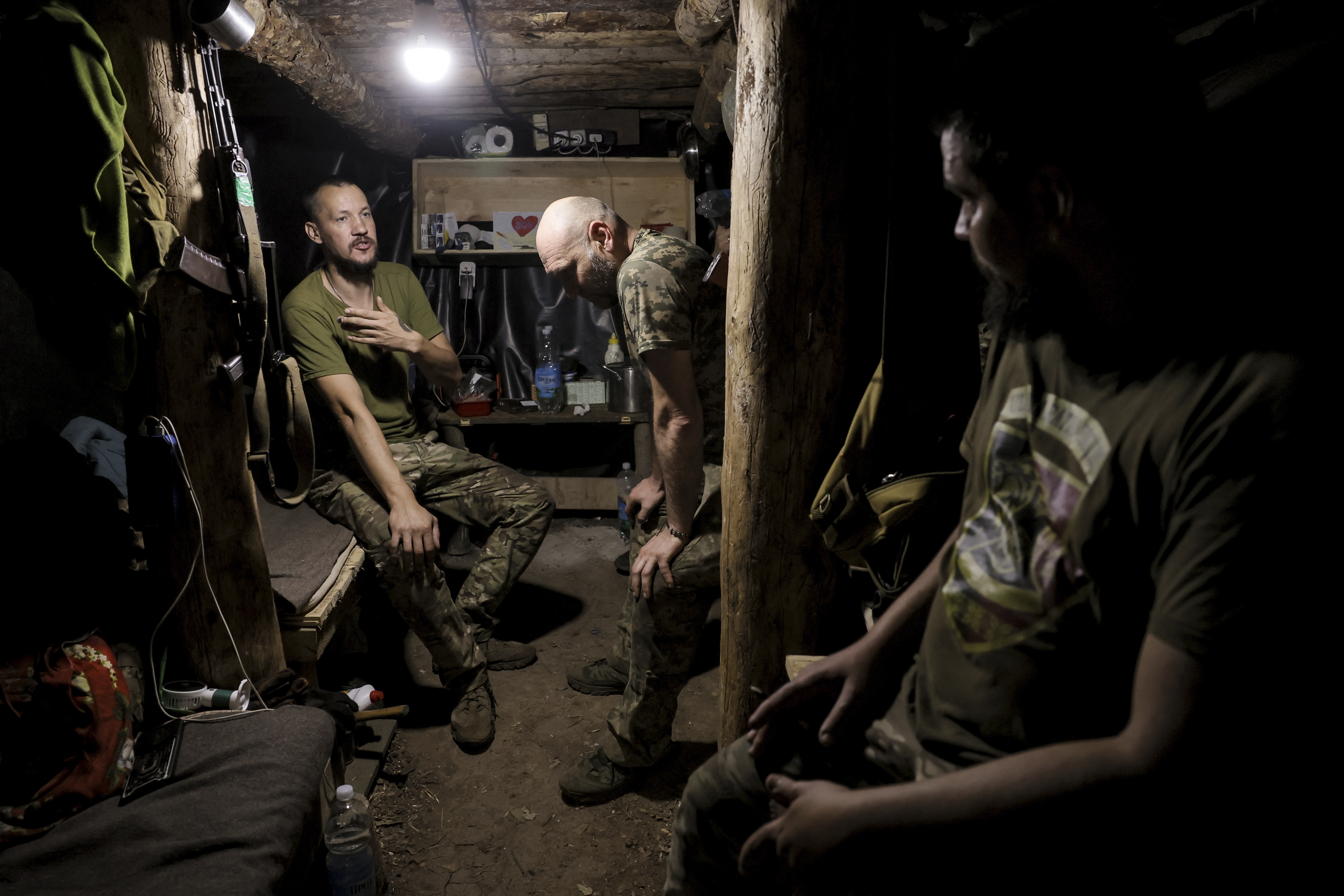 In this photo and provided by Ukraine's 24th Mechanized Brigade press service, soldiers have a rest in a shelter on the frontline near Chasiv Yar, Donetsk region, Ukraine, Tuesday, July 22, 2025. (Oleg Petrasiuk/Ukraine's 24th Mechanized Brigade via AP)