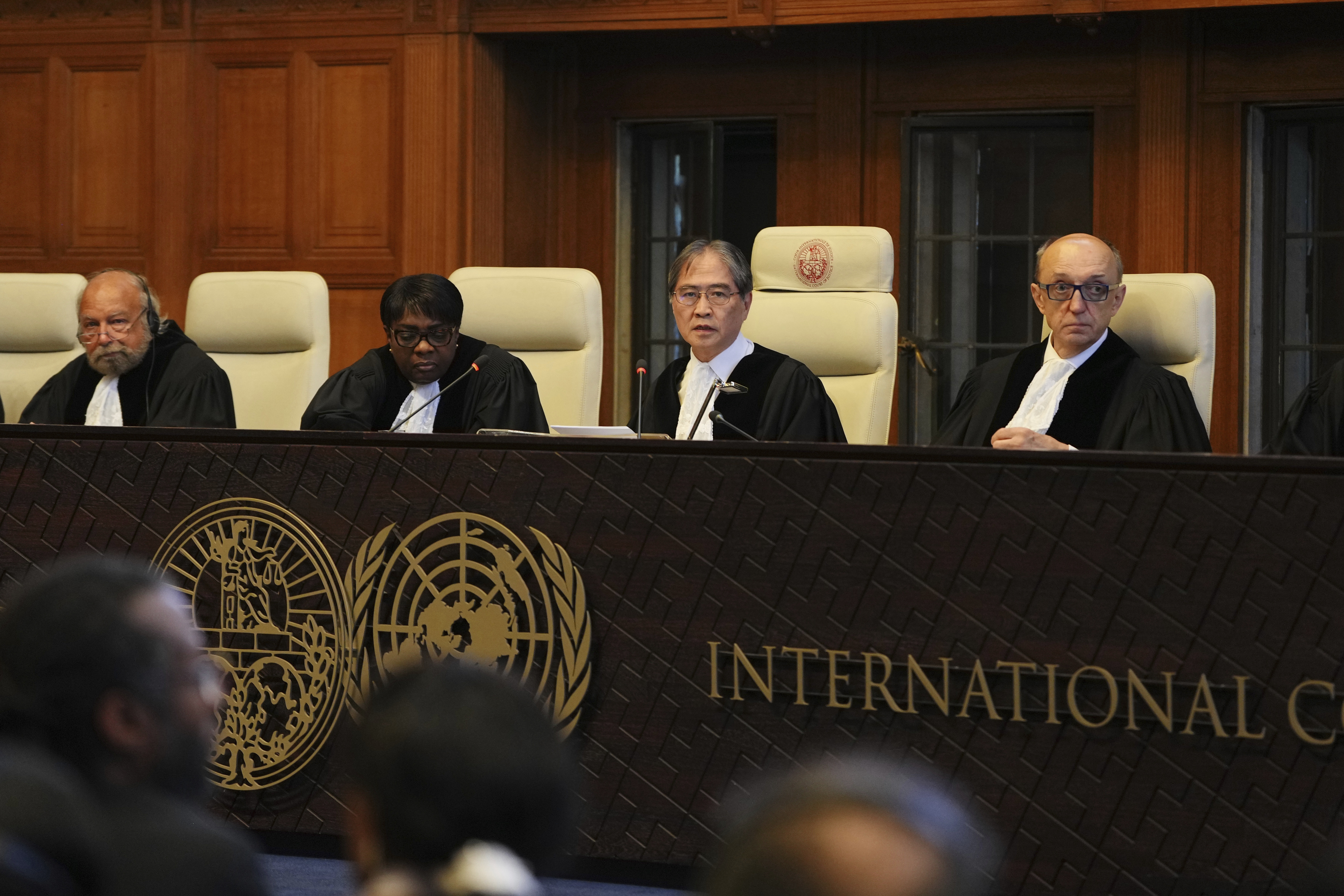 Presiding judge Yuji Iwasawa, second from right, speaks at a hearing to deliver an advisory opinion on what legal obligations nations have to address climate change and what consequences they may face if they don't, Wednesday, July 23, 2025, in The Hague, Netherlands. (AP Photo/Peter Dejong)