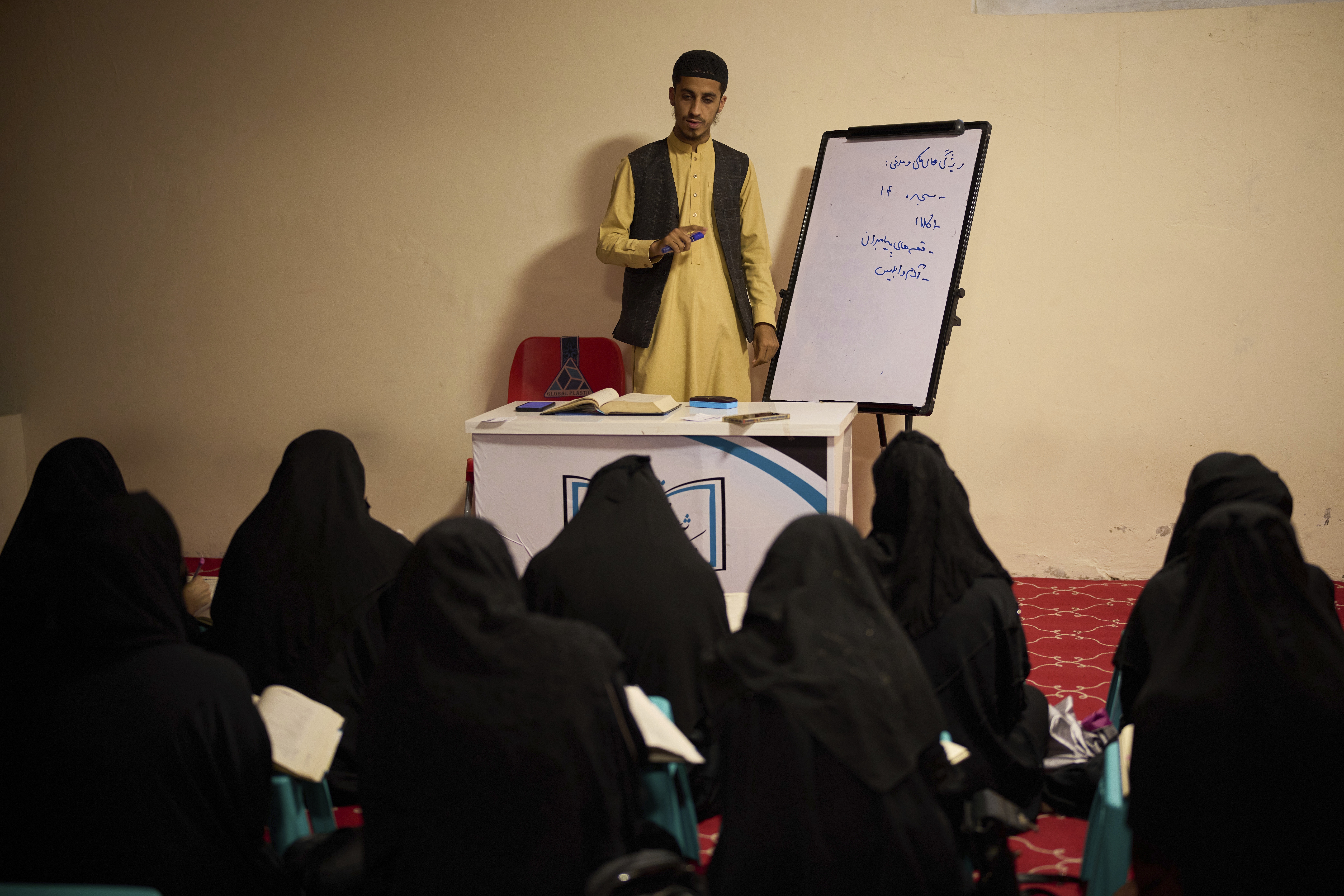 A teacher gives a religious studies lesson to girls at a religious education center in Kabul, Afghanistan, Wednesday, May 28, 2025. (AP Photo/Ebrahim Noroozi)