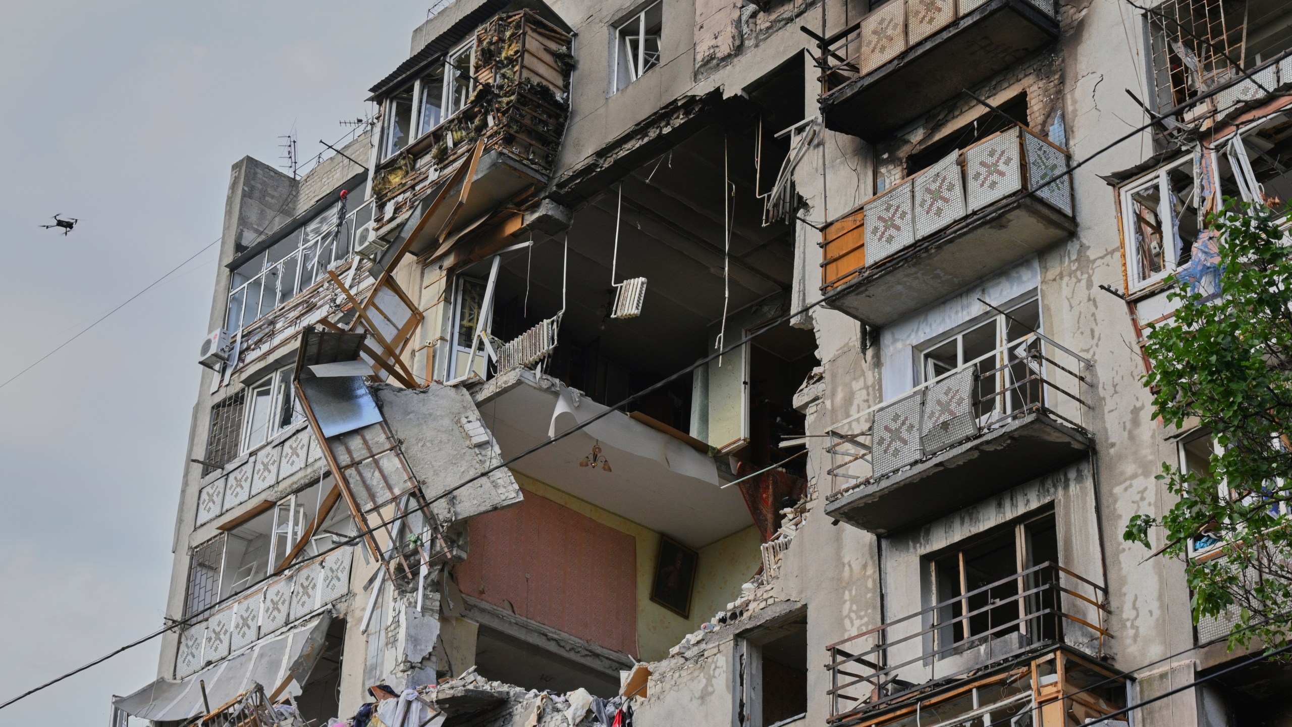 A residential building is damaged following Russia's drone attack in Odesa, Ukraine, Thursday, July 24, 2025. (AP Photo/Michael Shtekel)