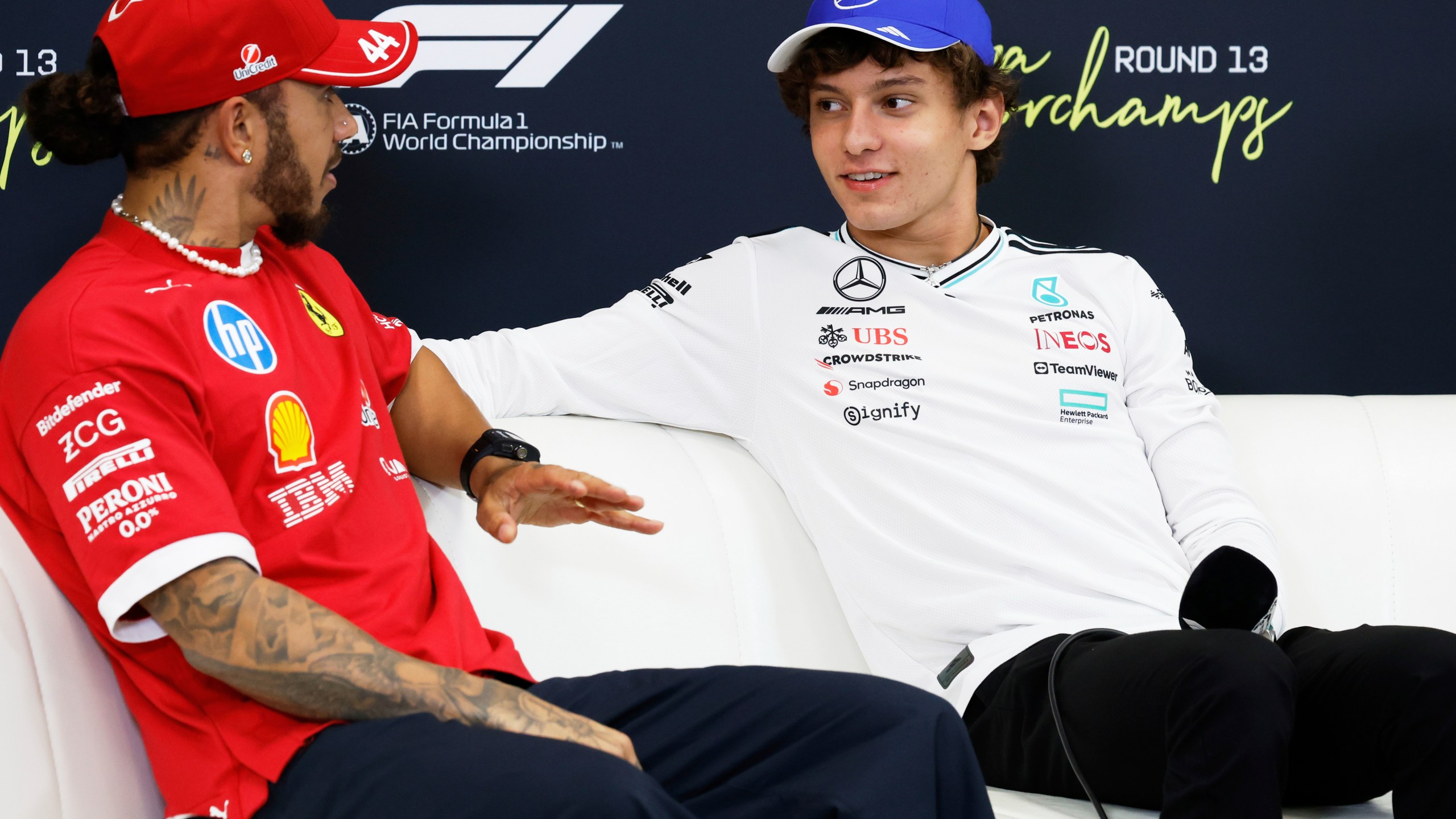 Mercedes driver Kimi Antonelli of Italy, right, and Ferrari driver Lewis Hamilton of Britain attend a media conference ahead of the Formula One Grand Prix at the Spa-Francorchamps racetrack in Spa, Belgium, Thursday, July 24, 2025. (AP Photo/Geert Vanden Wijngaert)