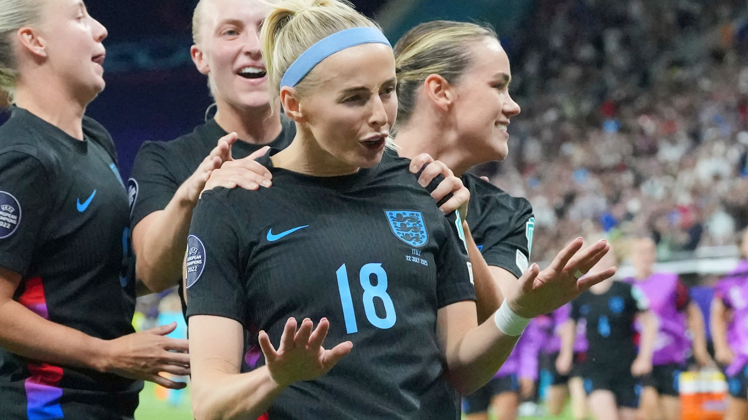 England's Chloe Kelly is celebrated after she scored the decisive second goal for England during the Women's Euro 2025 semifinals soccer match between England and Italy at Stade de Geneve in Geneva, Switzerland, Tuesday, July 22, 2025. (AP Photo/Martin Meissner)