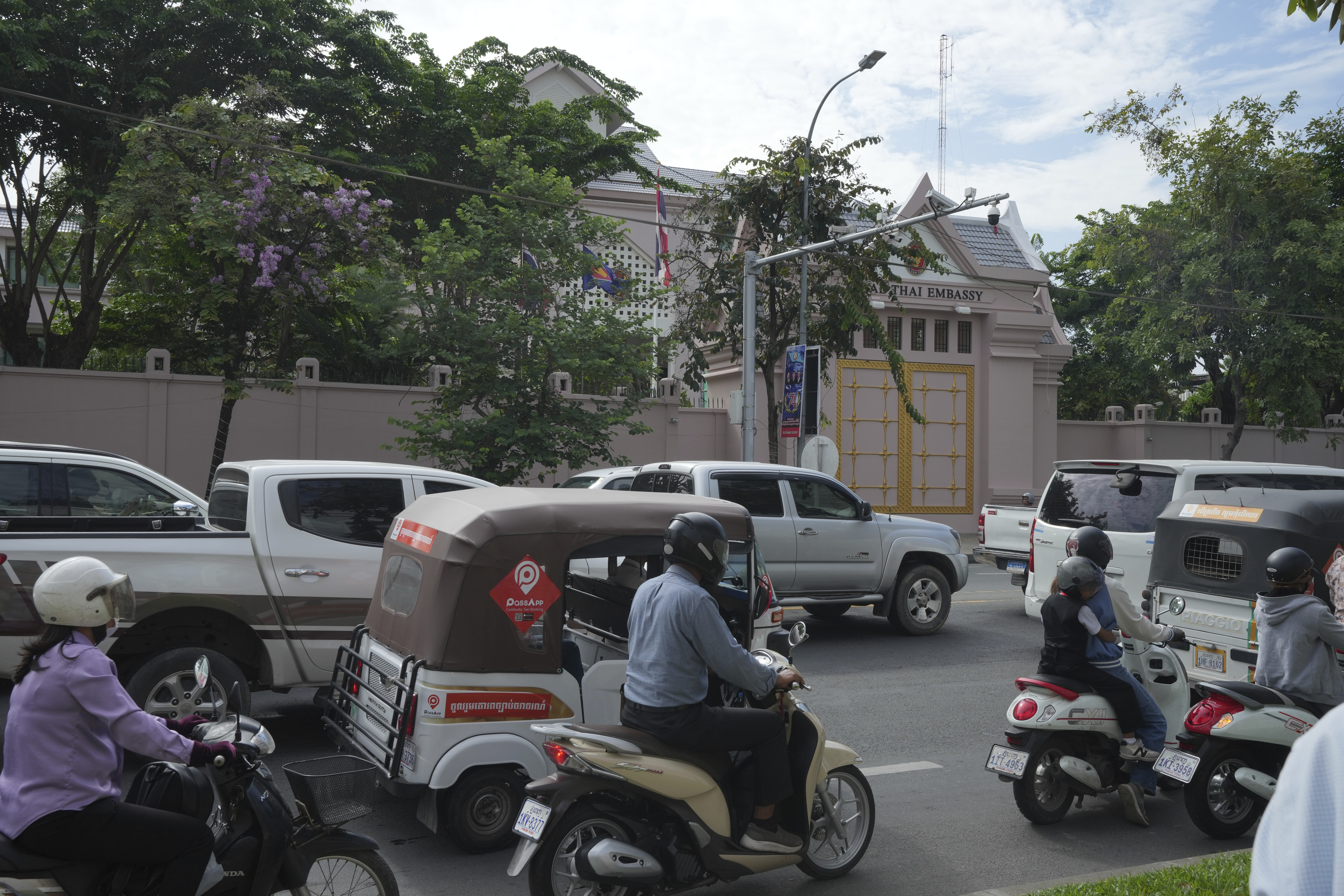 Local vehicles pass the Thai Embassy in Phnom Penh, Cambodia, Thursday, July 24, 2025. (AP Photo/Heng Sinith)