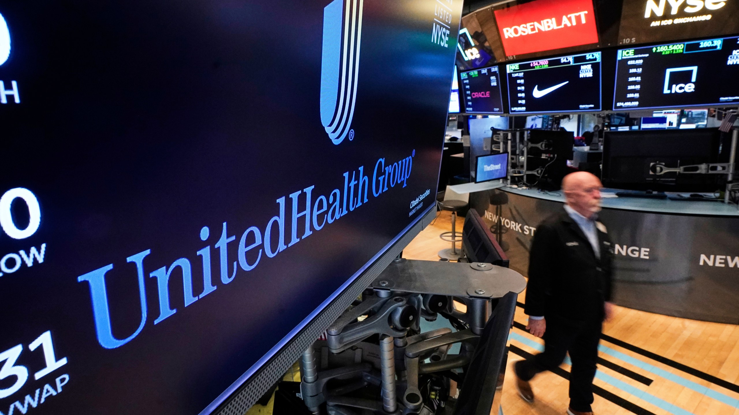FILE - The logo for UnitedHealth Group appears above a trading post on the floor of the New York Stock Exchange, April 17, 2025. (AP Photo/Richard Drew, file)