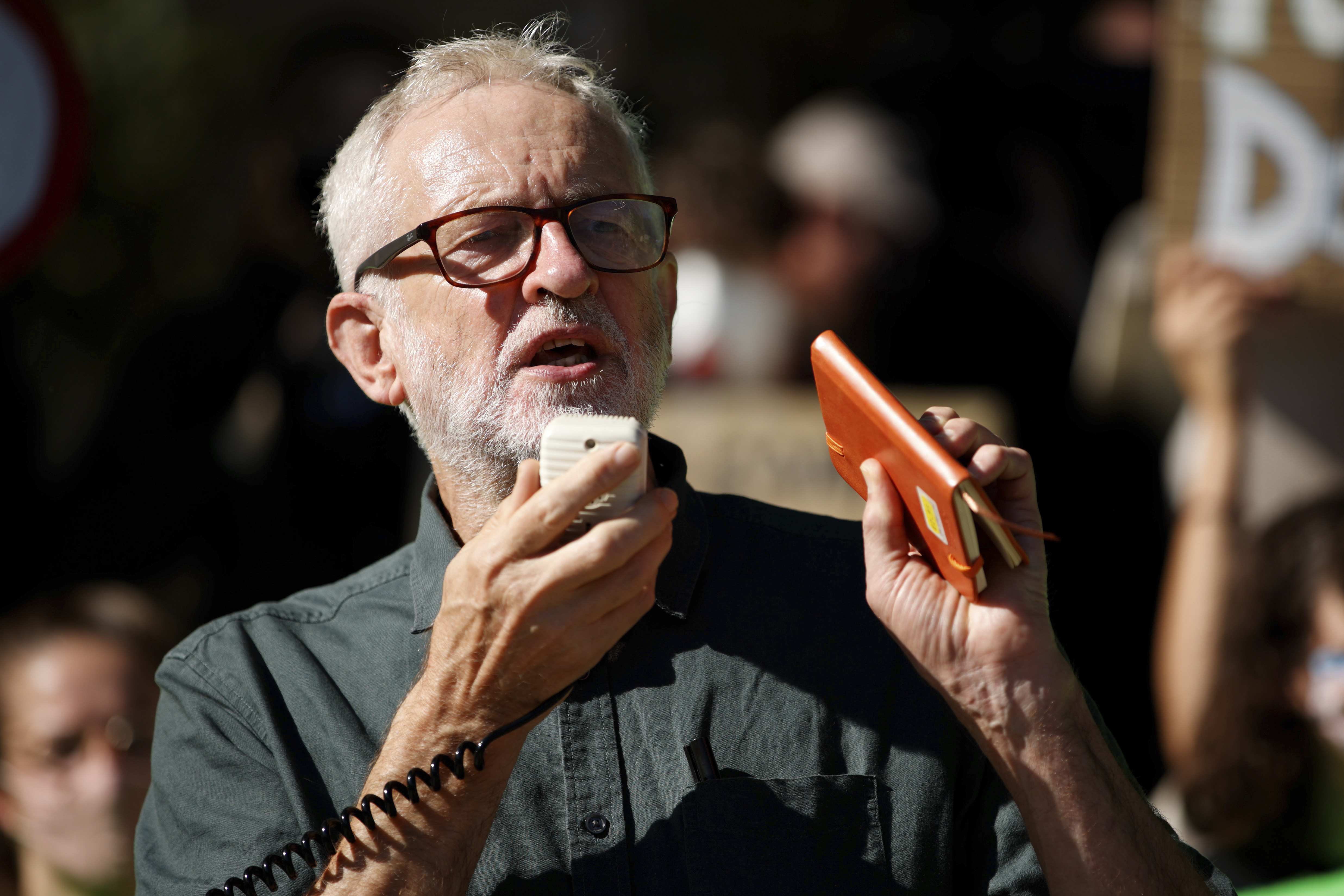 FILE - Former British Labour Party leader Jeremy Corbyn addresses activists at a 'climate strike' demonstration, part of the global 'Fridays for Future' movement led by Swedish teenage environmentalist Greta Thunberg, in Parliament Square in London, Sept. 24, 2021. (AP Photo/David Cliff, File)