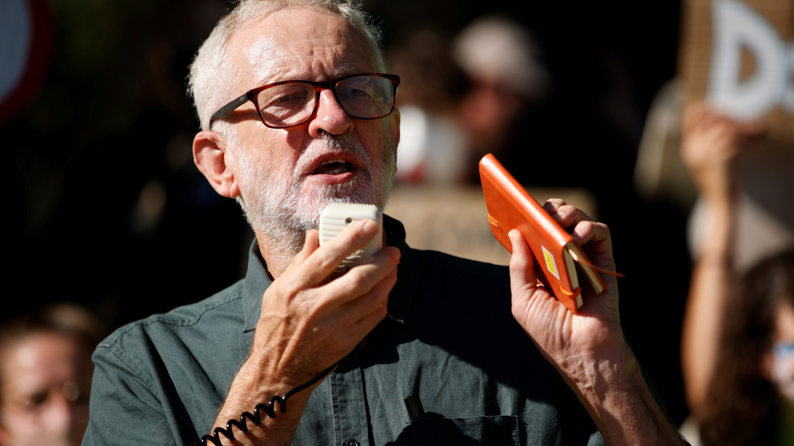 FILE - Former British Labour Party leader Jeremy Corbyn addresses activists at a 'climate strike' demonstration, part of the global 'Fridays for Future' movement led by Swedish teenage environmentalist Greta Thunberg, in Parliament Square in London, Sept. 24, 2021. (AP Photo/David Cliff, File)