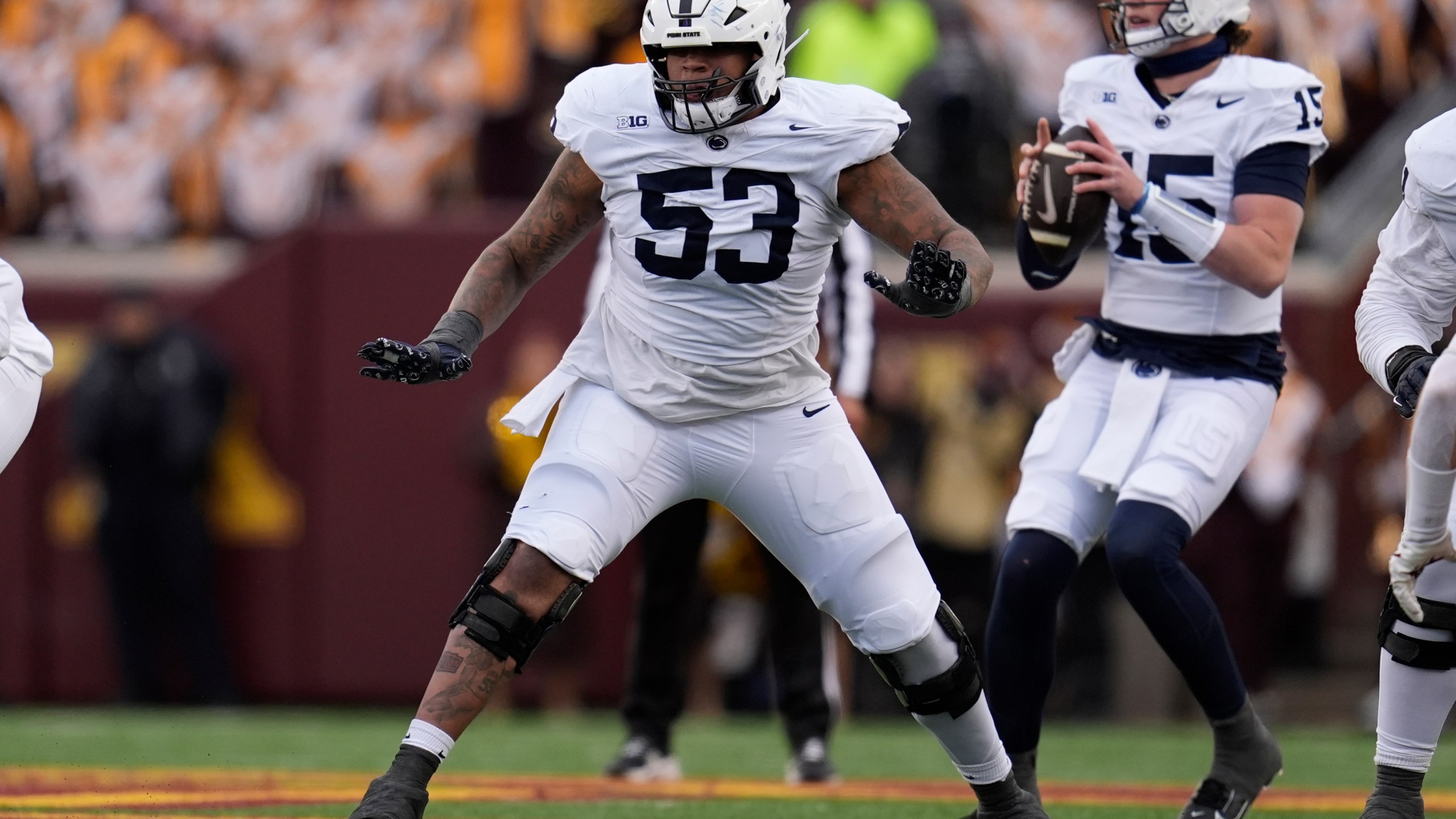 FILE - Penn State offensive lineman Nick Dawkins (53) in action during the first half of an NCAA college football game against Minnesota, Nov. 23, 2024, in Minneapolis. (AP Photo/Abbie Parr, File)