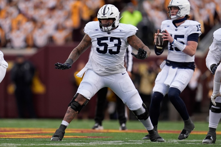 FILE - Penn State offensive lineman Nick Dawkins (53) in action during the first half of an NCAA college football game against Minnesota, Nov. 23, 2024, in Minneapolis. (AP Photo/Abbie Parr, File)