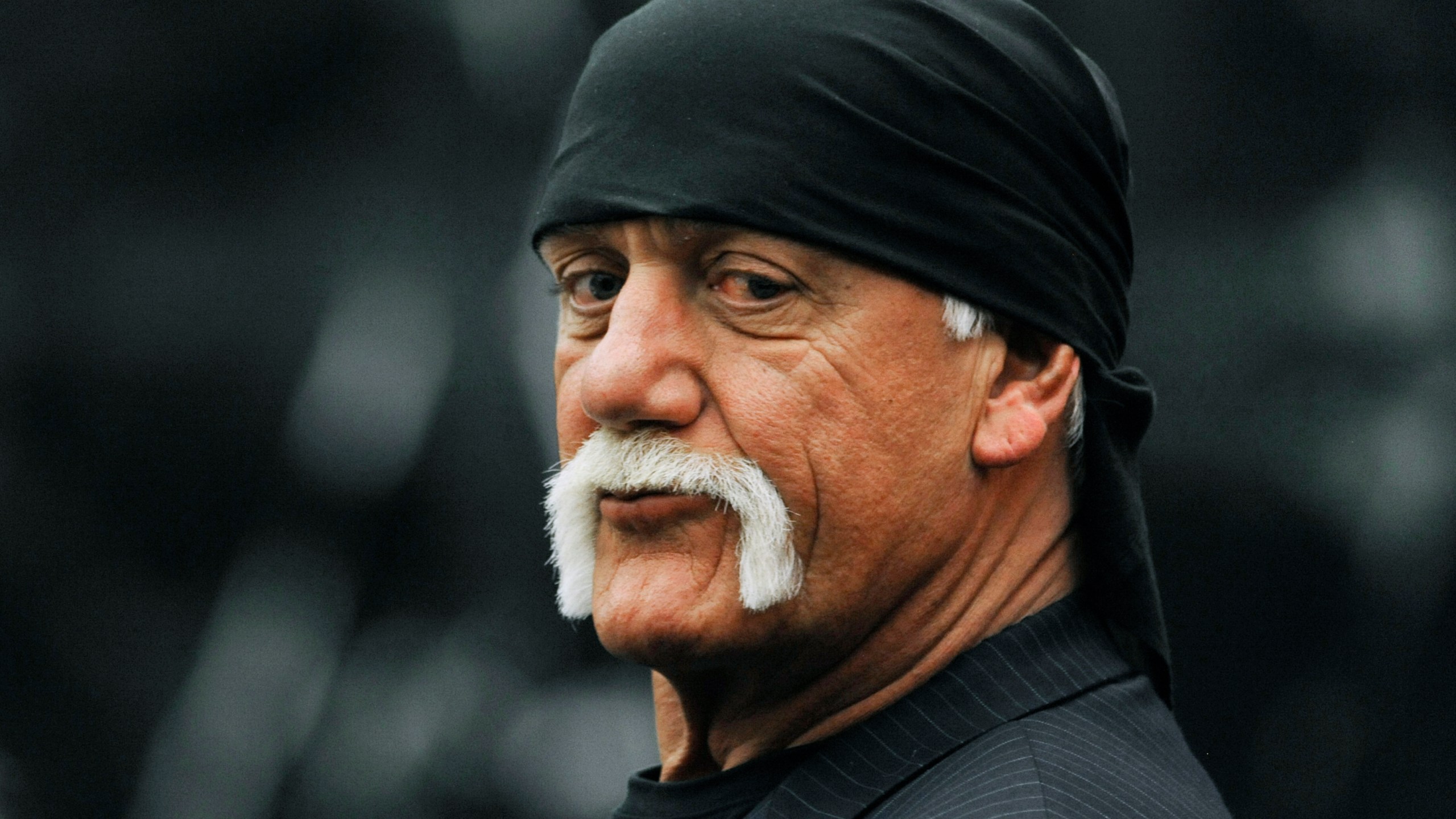 FILE - Hulk Hogan, whose given name is Terry Bollea, waits in the courtroom during a break in his trial against Gawker Media in St. Petersburg, Fla., March 9, 2016. (AP Photo/Steve Nesius, Pool, File)
