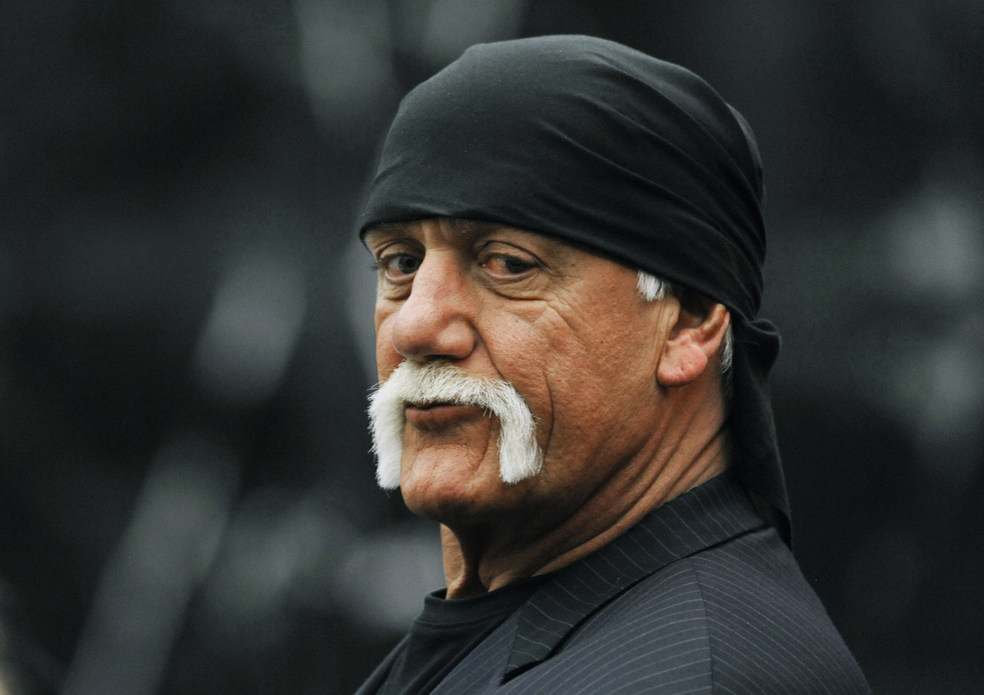 FILE - Hulk Hogan, whose given name is Terry Bollea, waits in the courtroom during a break in his trial against Gawker Media in St. Petersburg, Fla., March 9, 2016. (AP Photo/Steve Nesius, Pool, File)