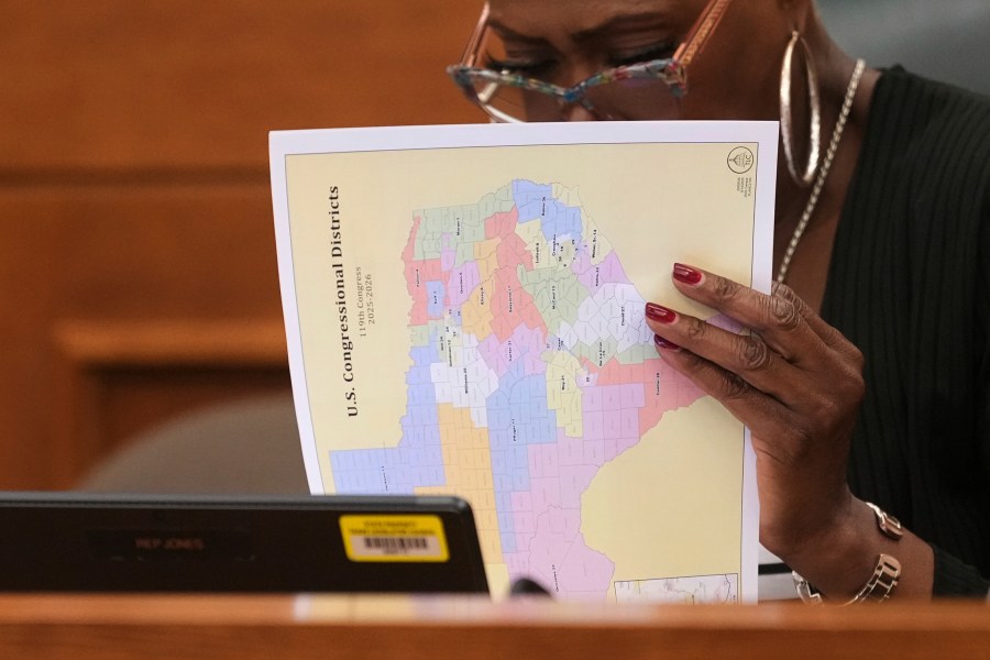 Texas state Rep. Jolanda "Jo" Jones looks through U.S. Congressional District maps during a redistricting hearing at the Texas Capitol, Thursday, July 24, 2025, in Austin, Texas. (AP Photo/Eric Gay)