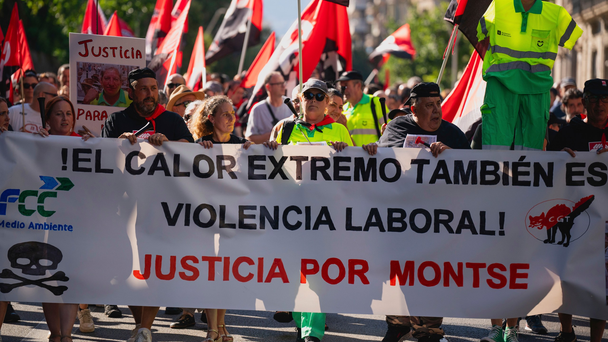 FILE - People march in Barcelona to protest the death of street cleaner Montse Aguilar during a recent heat wave in Spain, Wednesday, July 16, 2025. The banner in Spanish reads, “Extreme Heat is also Workplace Violence. Justice for Montse." (AP Photo/Joan Mateu Parra, File)