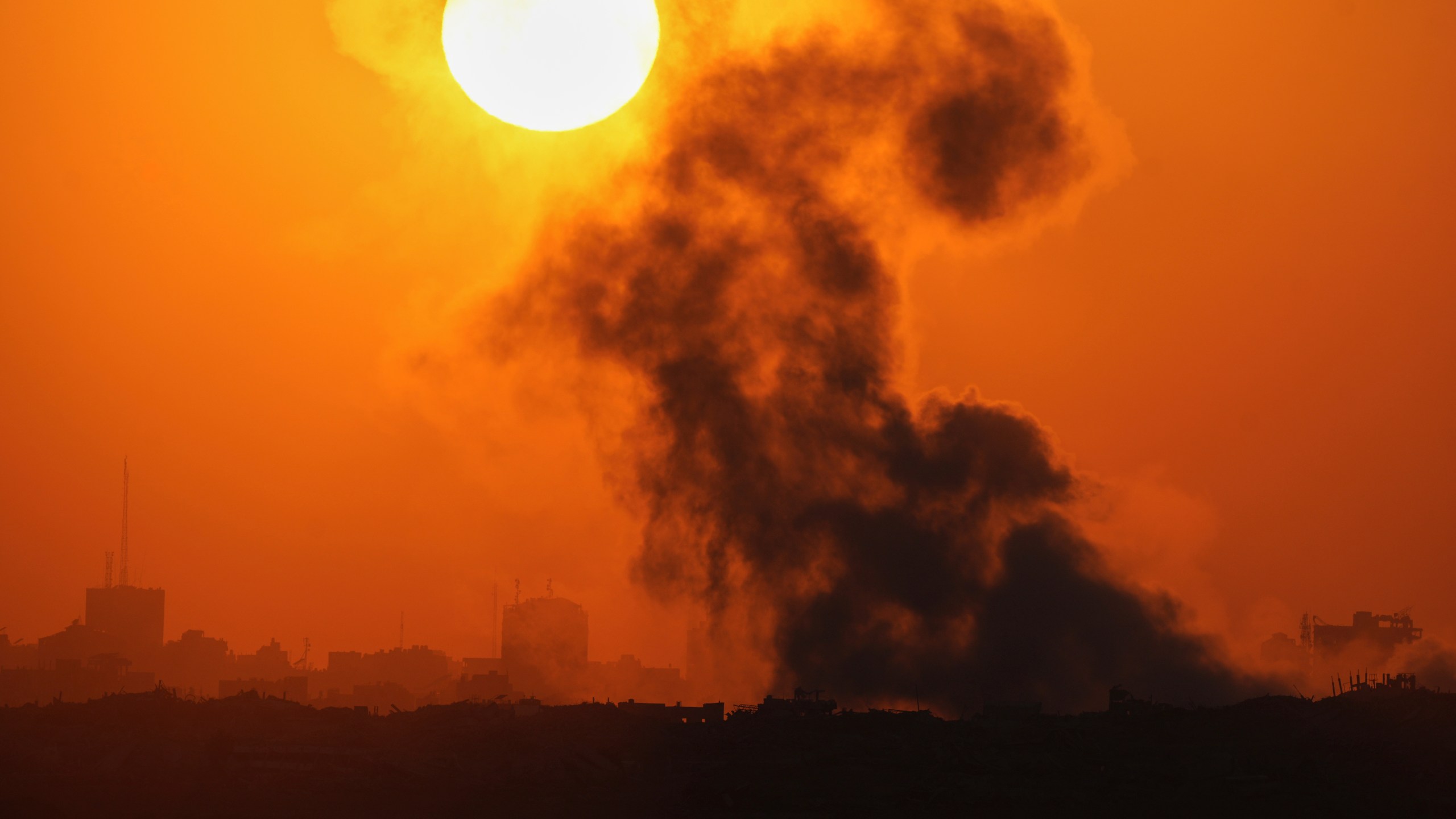 Smoke billows from an explosion in the northern Gaza Strip, as seen from southern Israel Wednesday, July 23, 2025. (AP Photo/Ohad Zwigenberg)